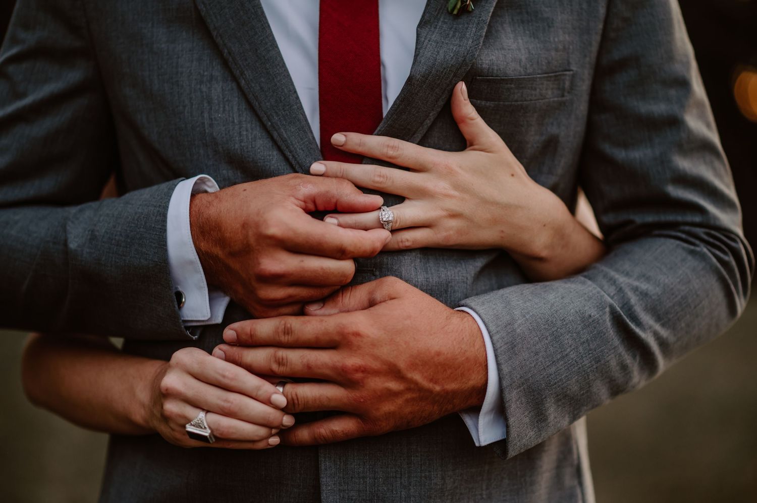 Ring shot of the couple putting each other's rings on. Indianapolis wedding photographer