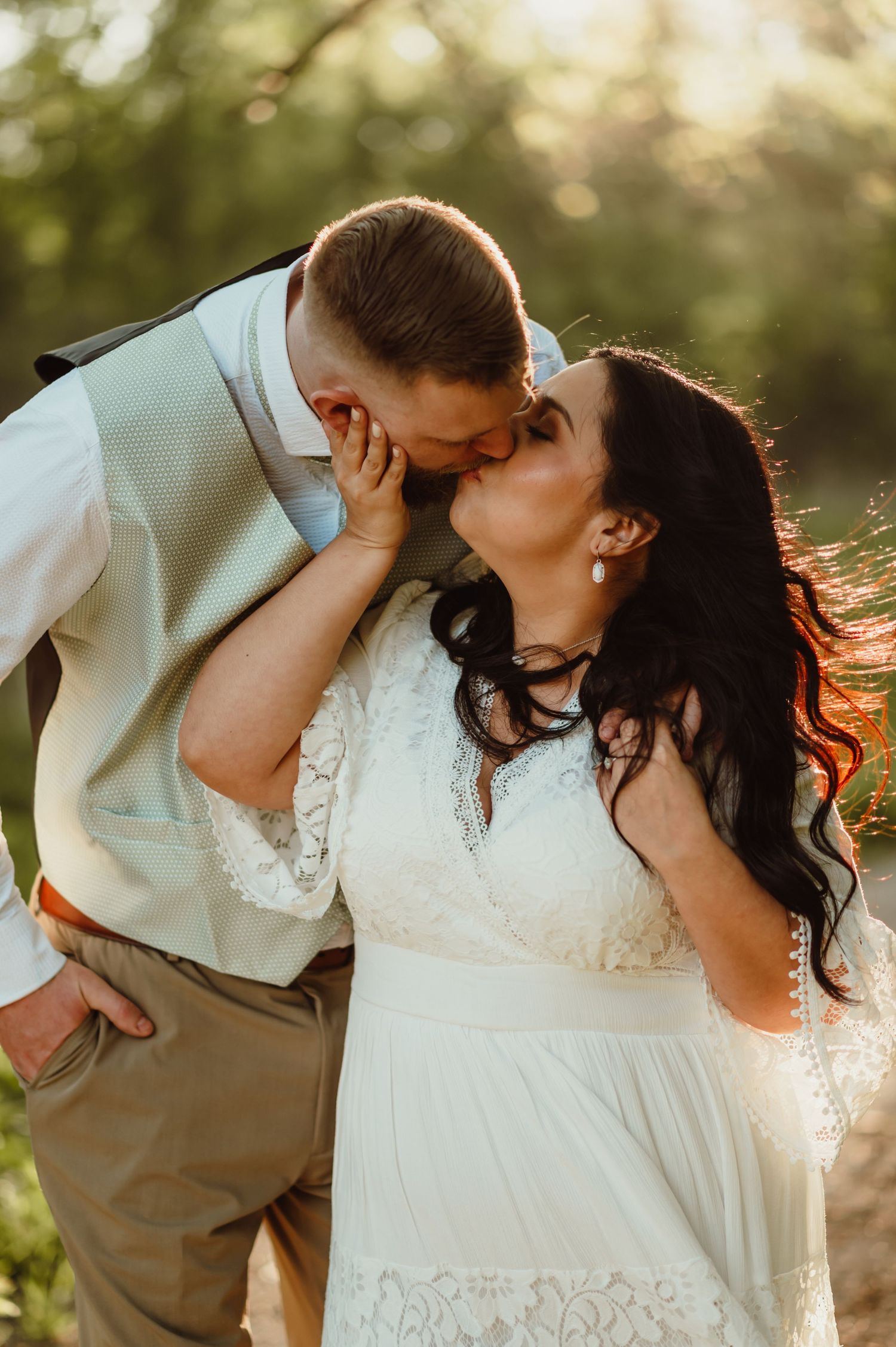 Golden hour engagement session of couple kissing at Eagle Creek Park in Indianapolis, Indiana. Indianapolis wedding photographer