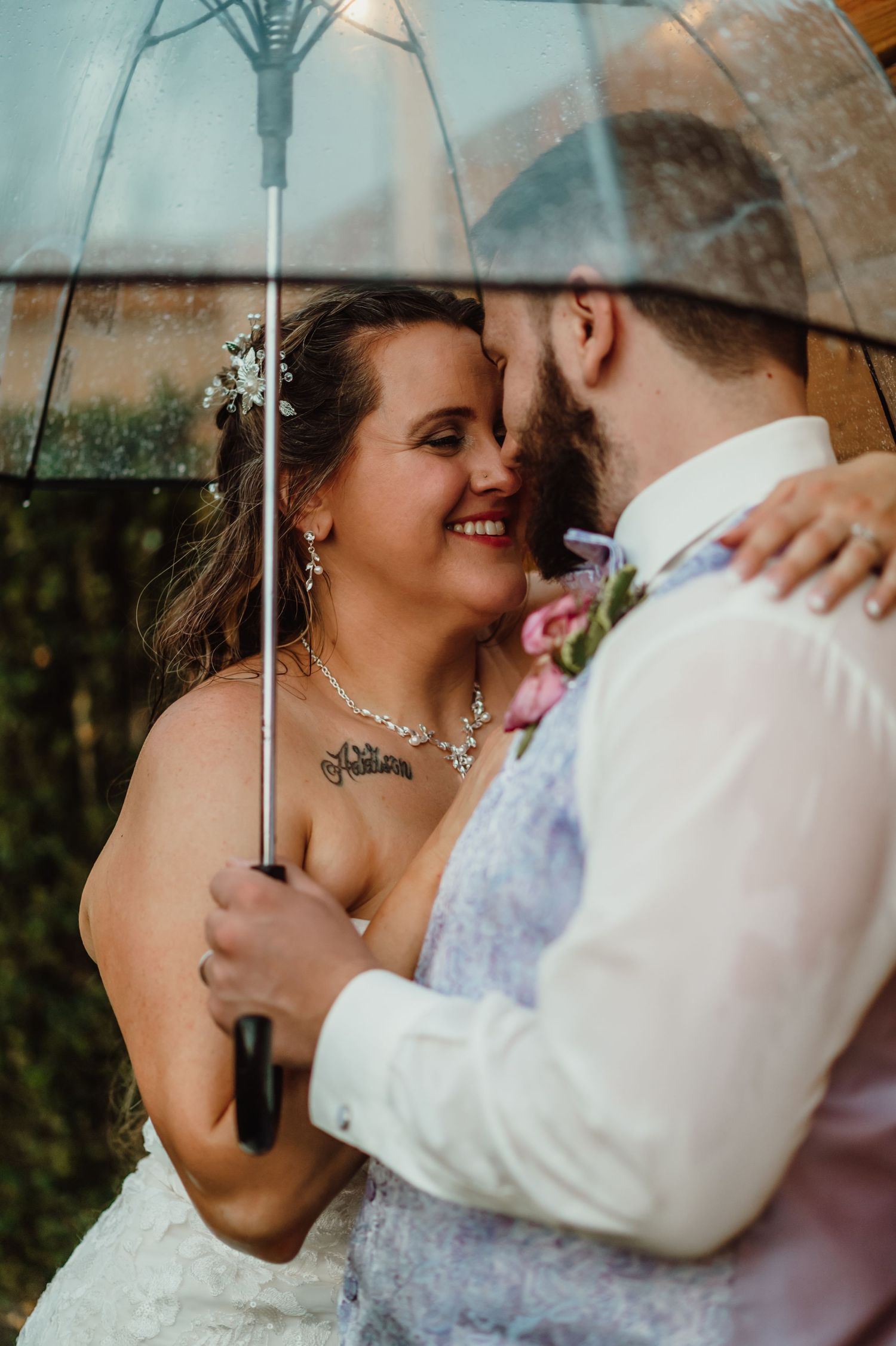 Portrait of Bride and Groom under an umbrella at their wedding at Radius Venue in Indianapolis, Indiana
