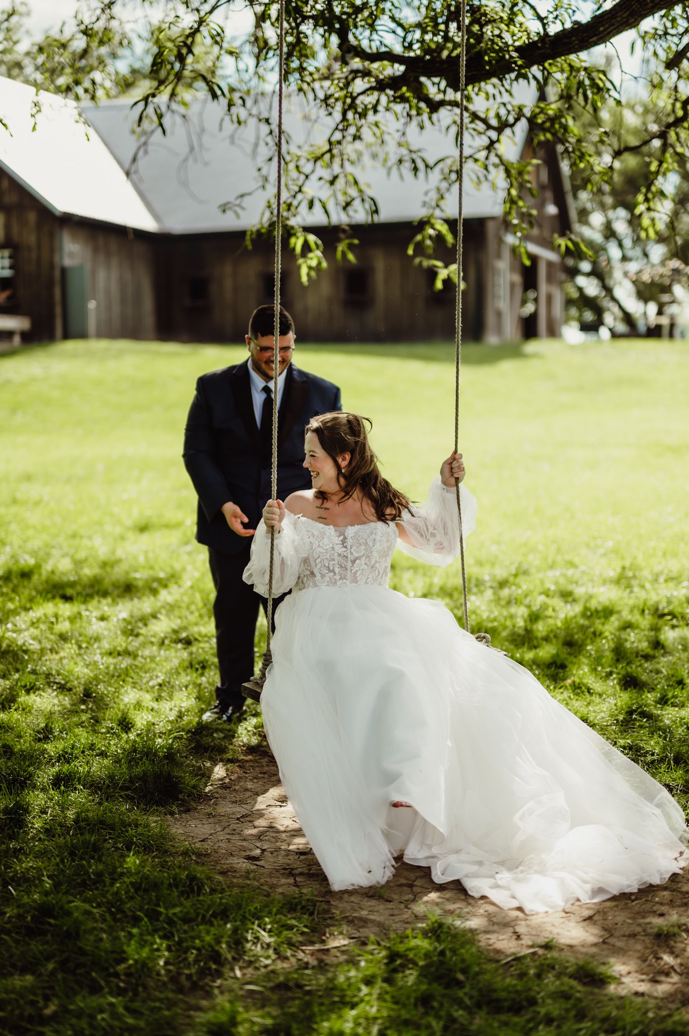 Groom swinging Bride on their wedding day at Kennedy Estate in Lizton, Indiana
