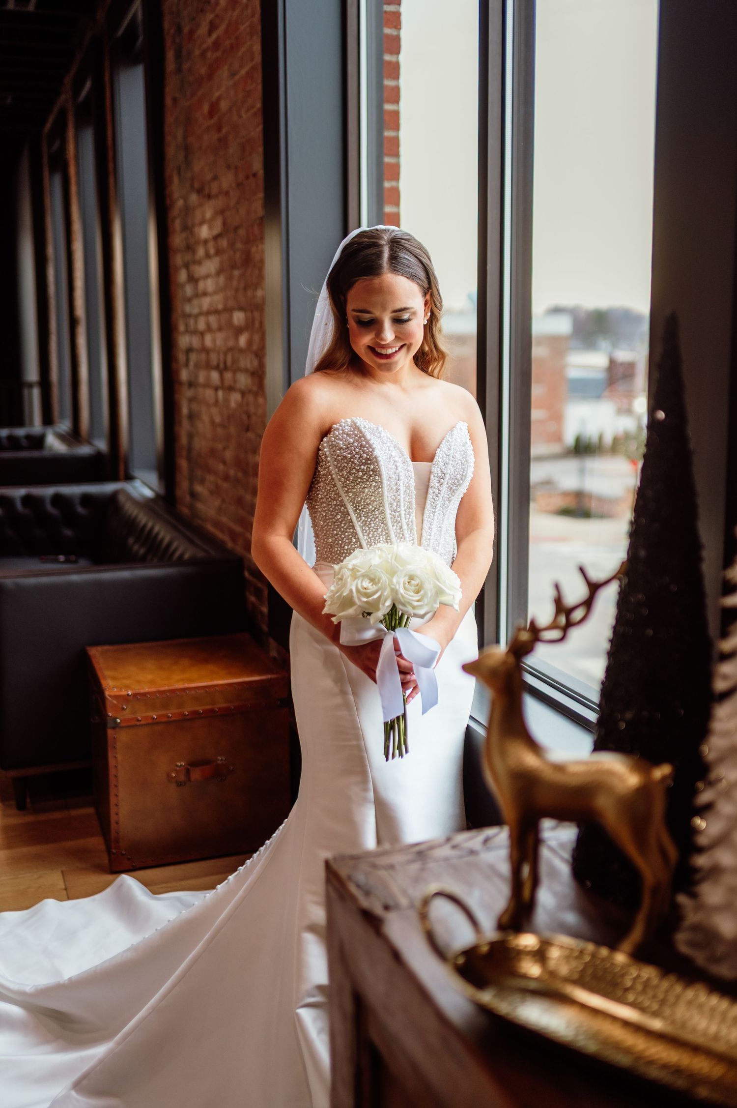 Bridal portrait of bride as she looks down at her bouquet. Indianapolis wedding photographer