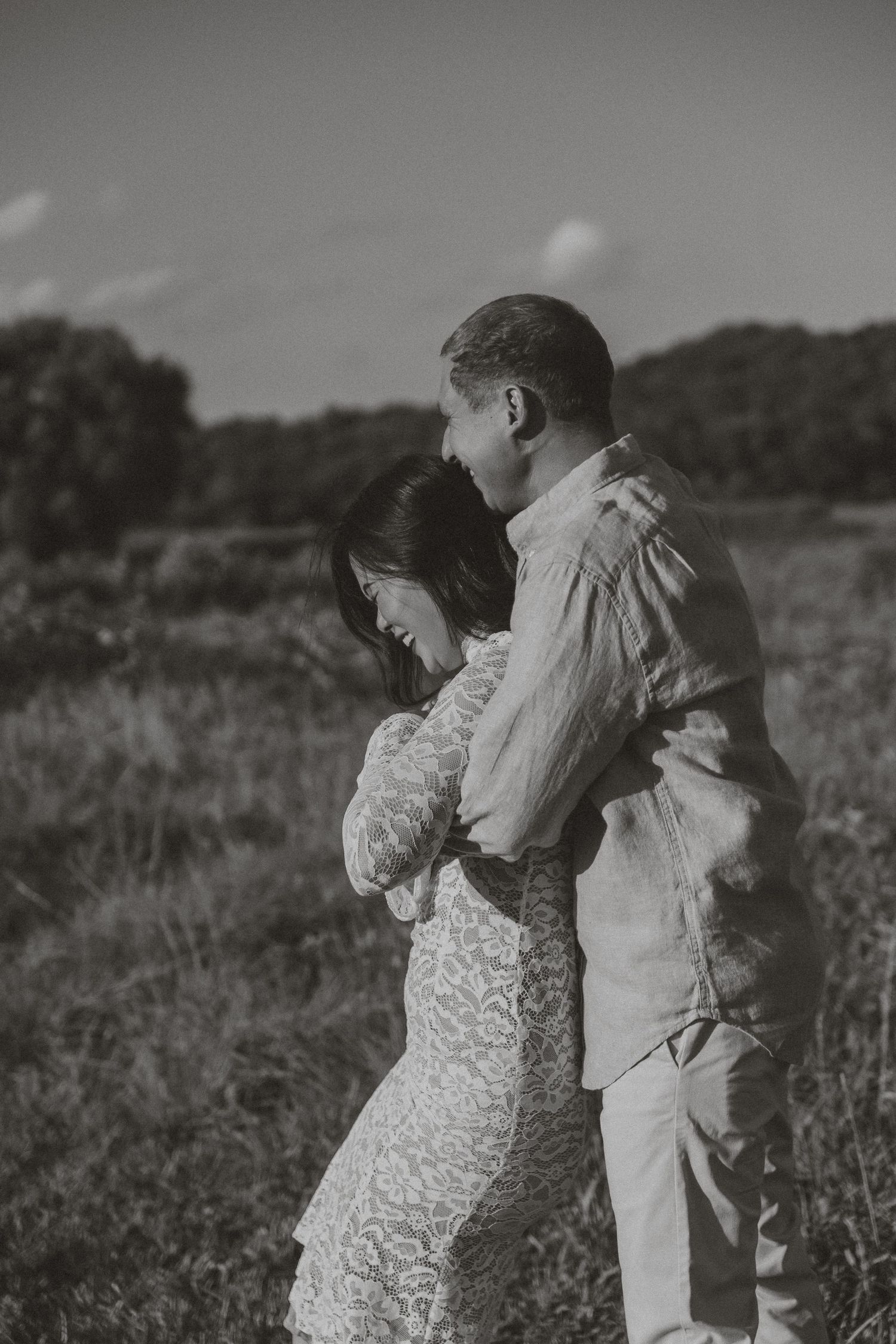 Couple walking together during a golden hour engagement session in Knoxville, TN at Melton Park.