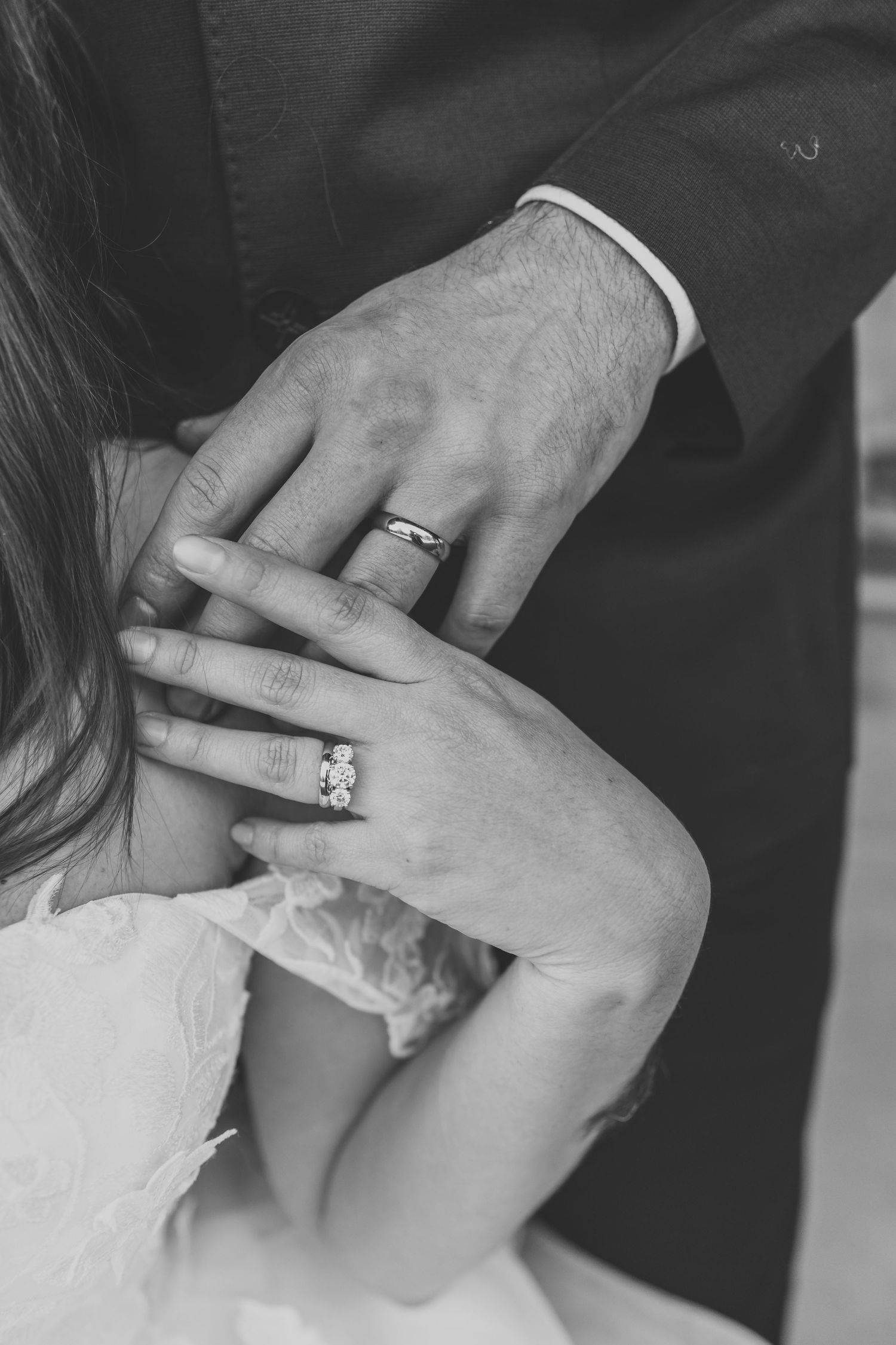 Close up of a bride and groom holding hands during their wedding ceremony. In Maryville, TN at Montvale Springs