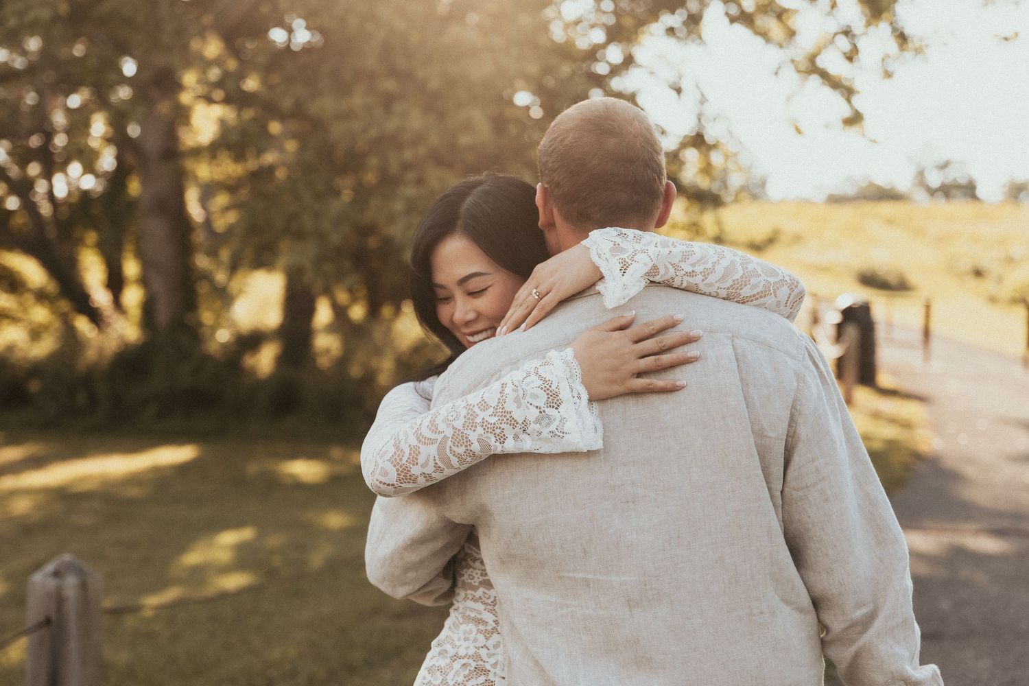 Couple embracing during a golden hour couples photography session in Knoxville, TN at Melton Park.