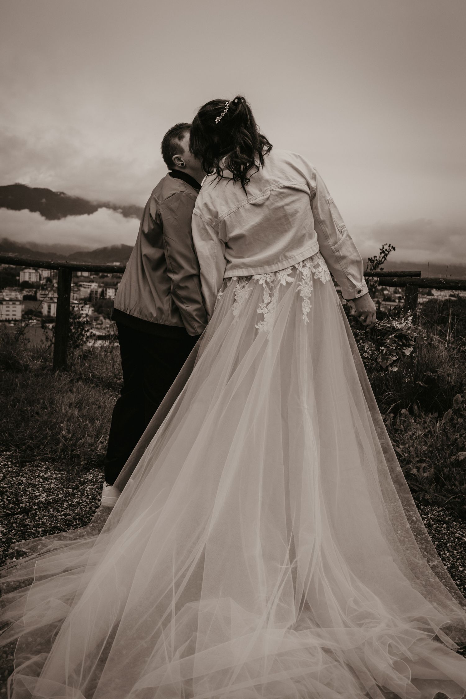 Flowing tulle wedding dress captured in romantic black and white photography.