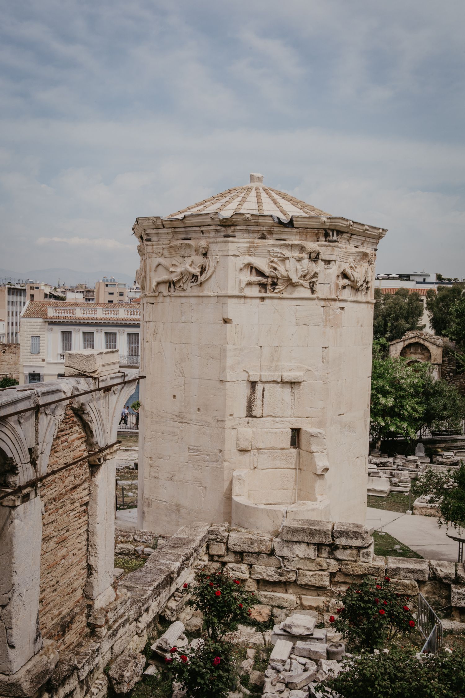 Ancient stone ruins and architectural details of a classical Greek structure.