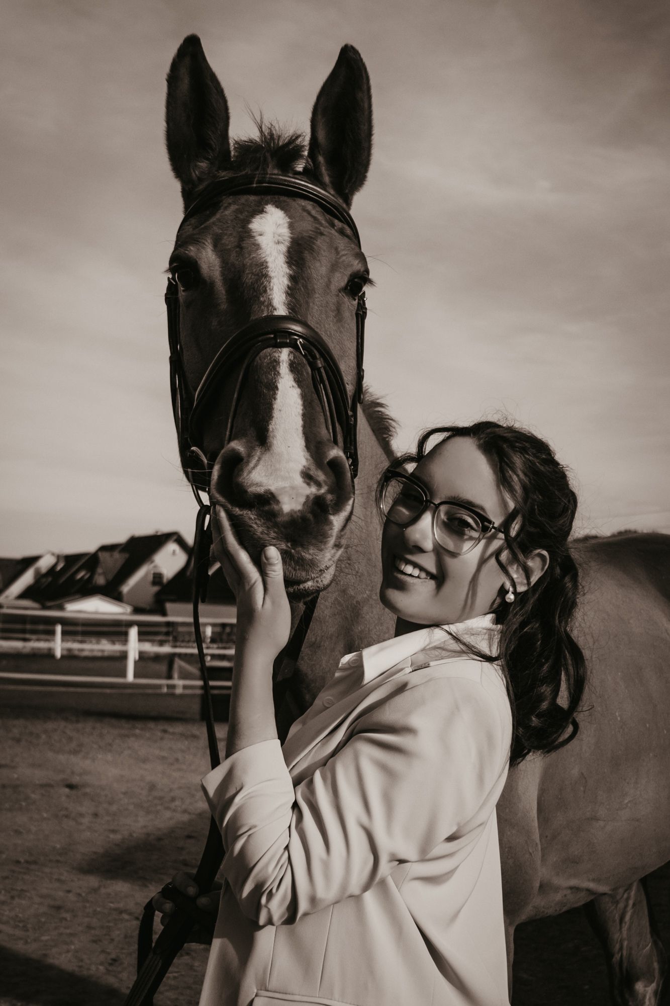 Artistic black and white series showing connection between a dark horse and person in natural light.