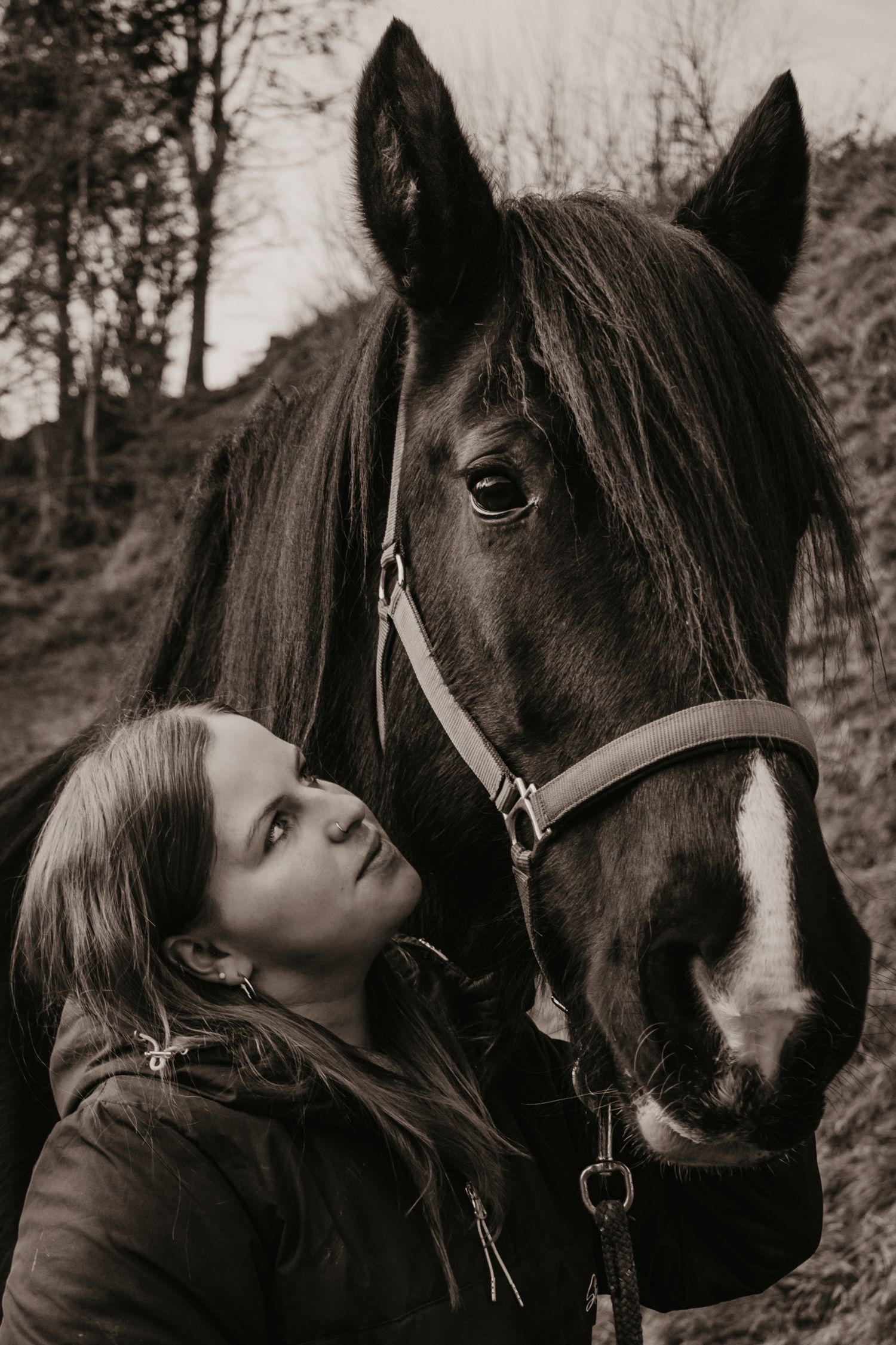 Black and white portrait series showing affectionate moments between person and horse.