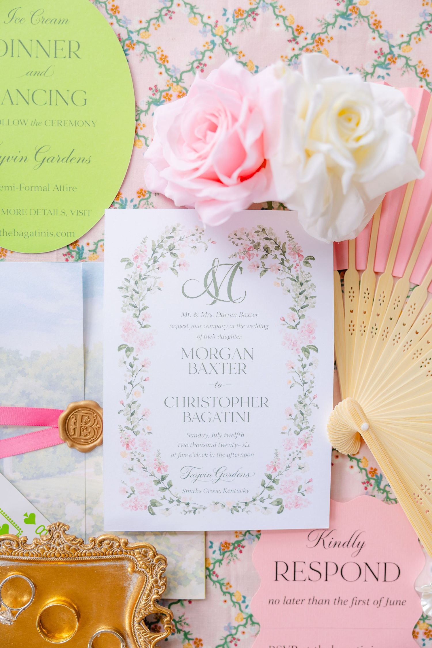 Elegant wedding invitation suite with floral border, pink and white roses, hand fan, and RSVP card on pastel background.