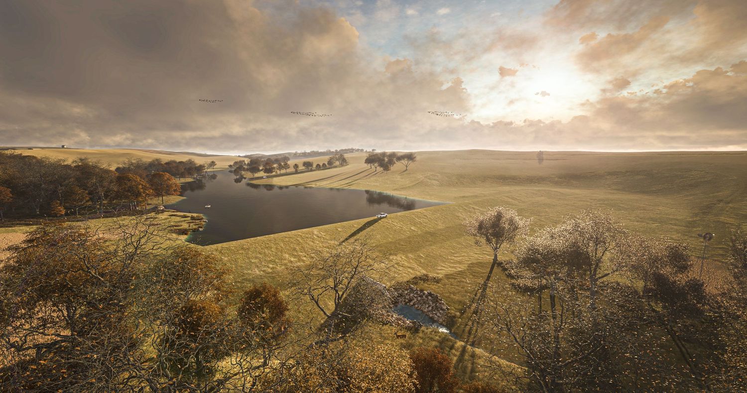A panoramic view of rolling green hills and valleys at sunset with dramatic clouds in the sky.