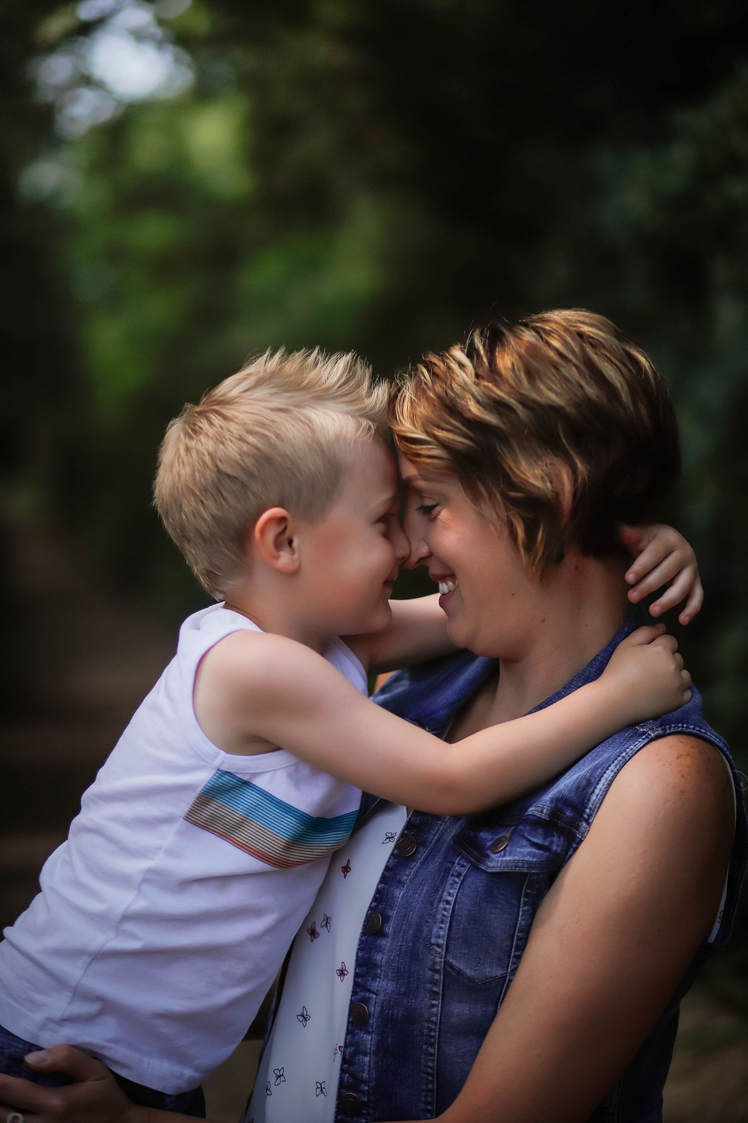 A tender moment between parent and child captured in a series of intimate outdoor portraits.