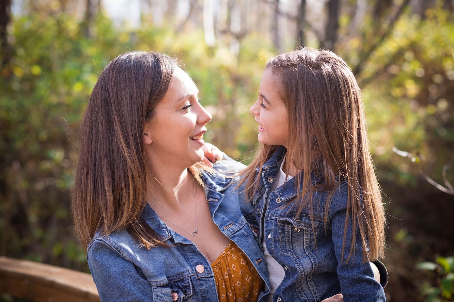 Series of candid moments between siblings wearing matching denim outfits.