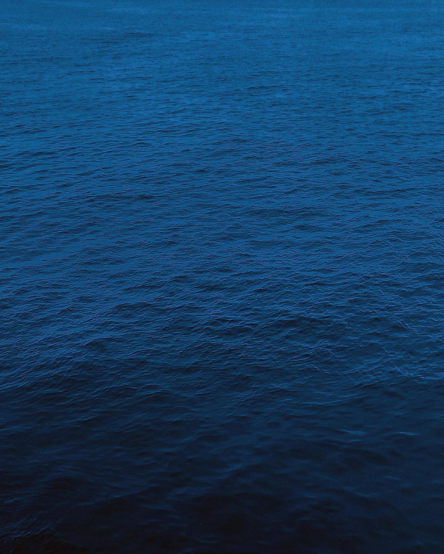 Dark blue ocean with small waves in a calm sea state