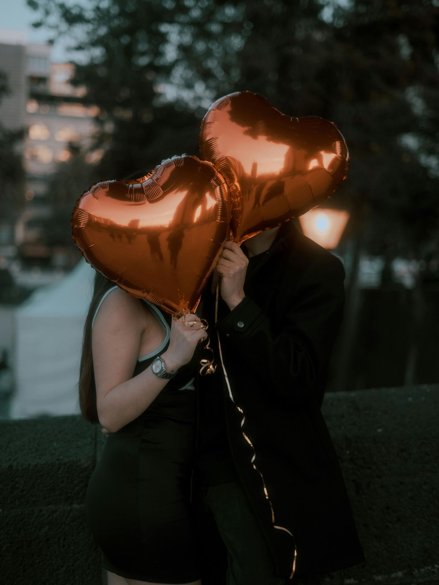 outdoor couple portrait with artistic lighting and romantic storytelling, featuring a film inspired atmosphere and emotional scene