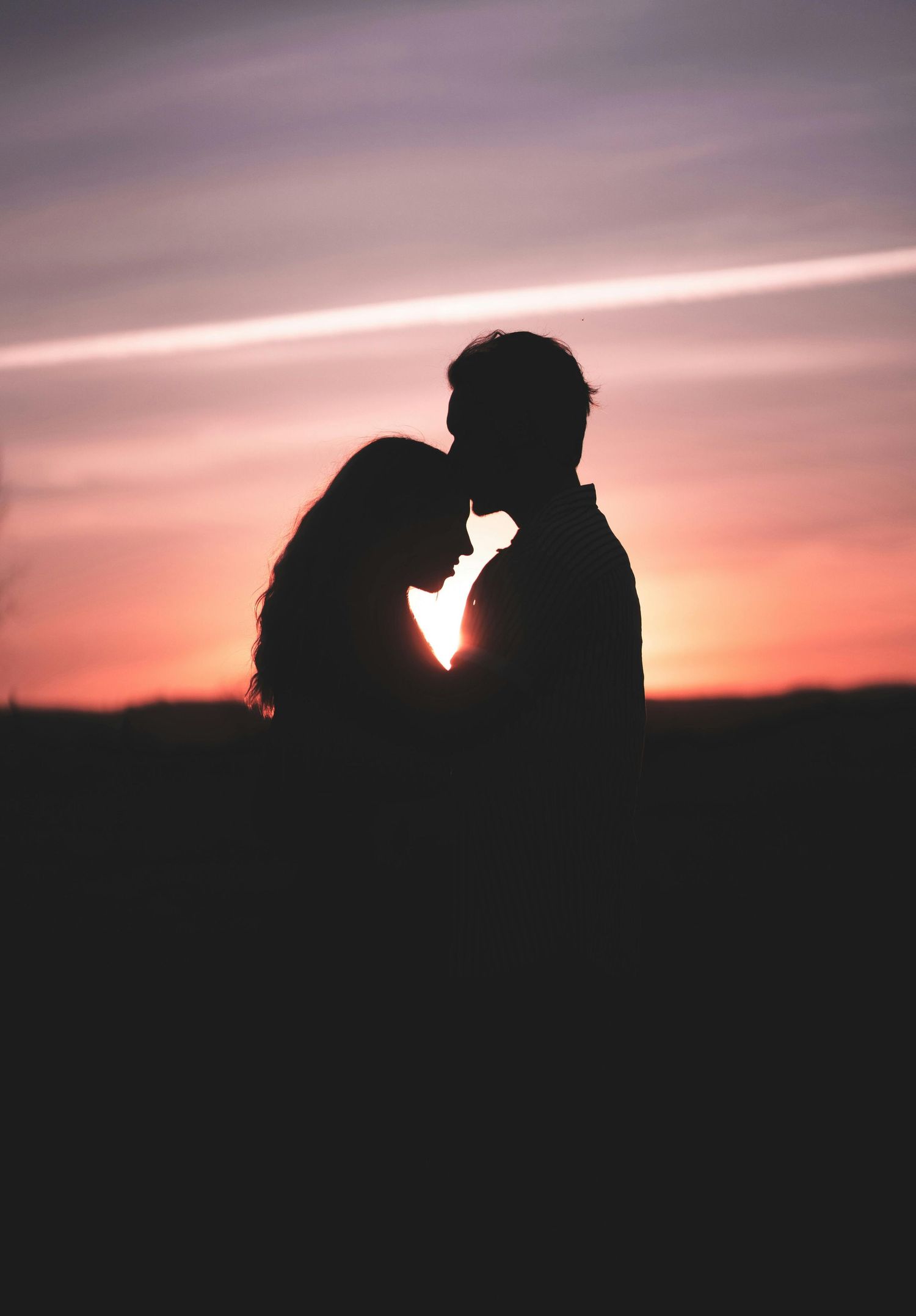 couple photo during evening at a park hugging each other showing love