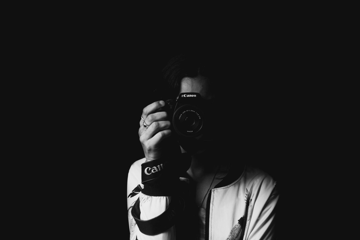 Photographer taking a photo in a studio capturing moment