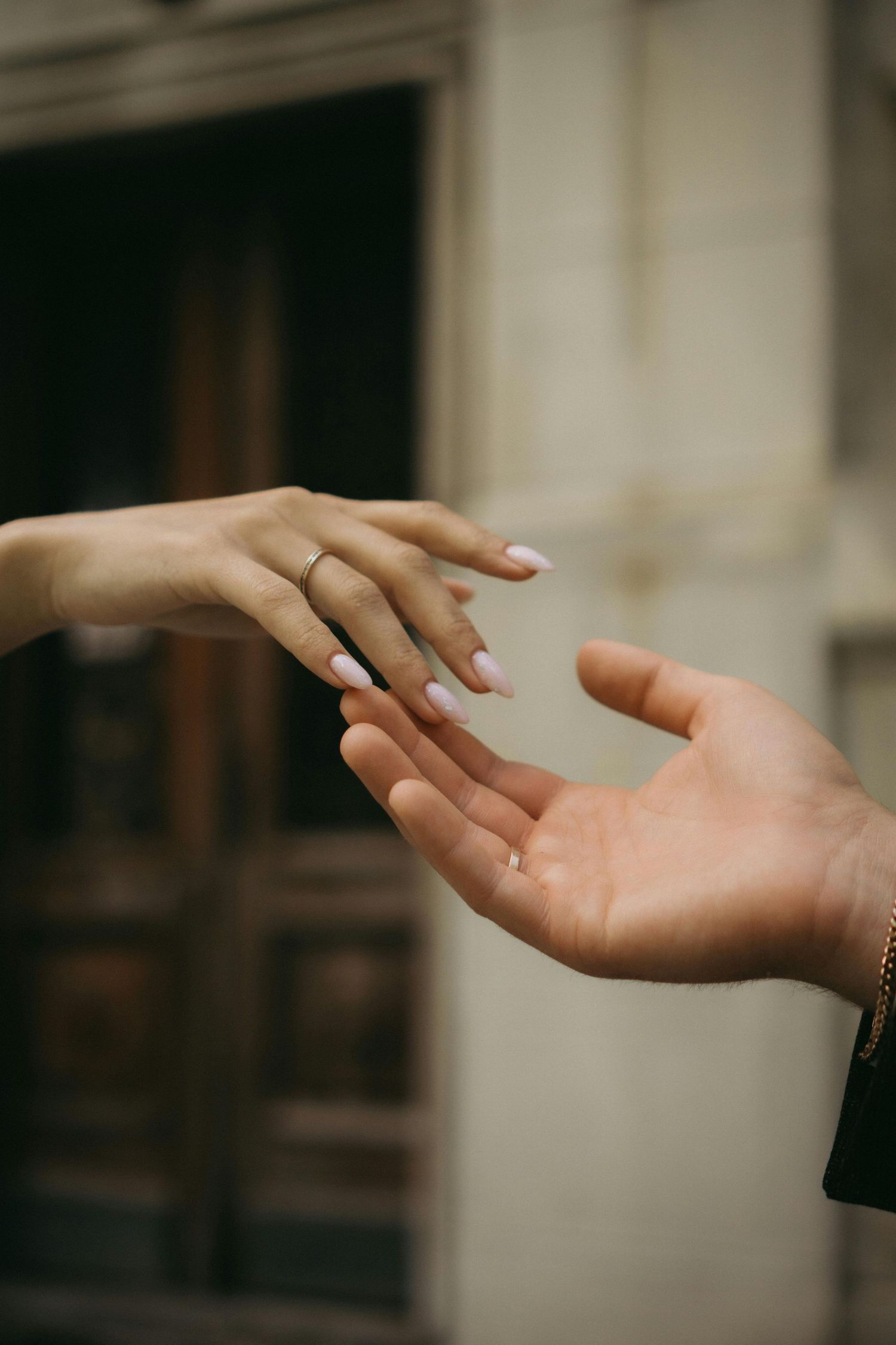 A sequence of graceful hand gestures showing elegant movements against a soft blurred background