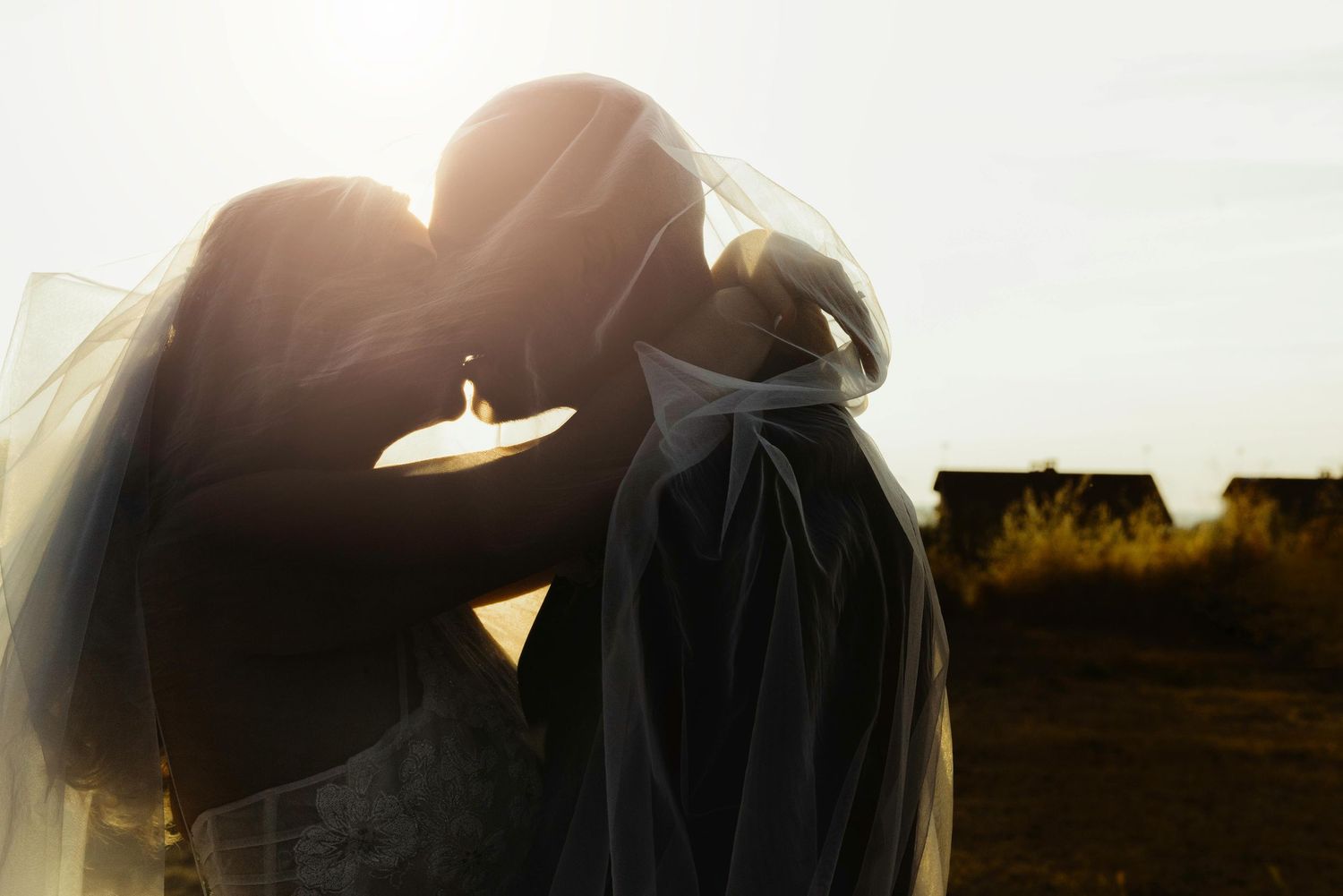 Intimate moment between couple at a park during golden hour for their elopement session