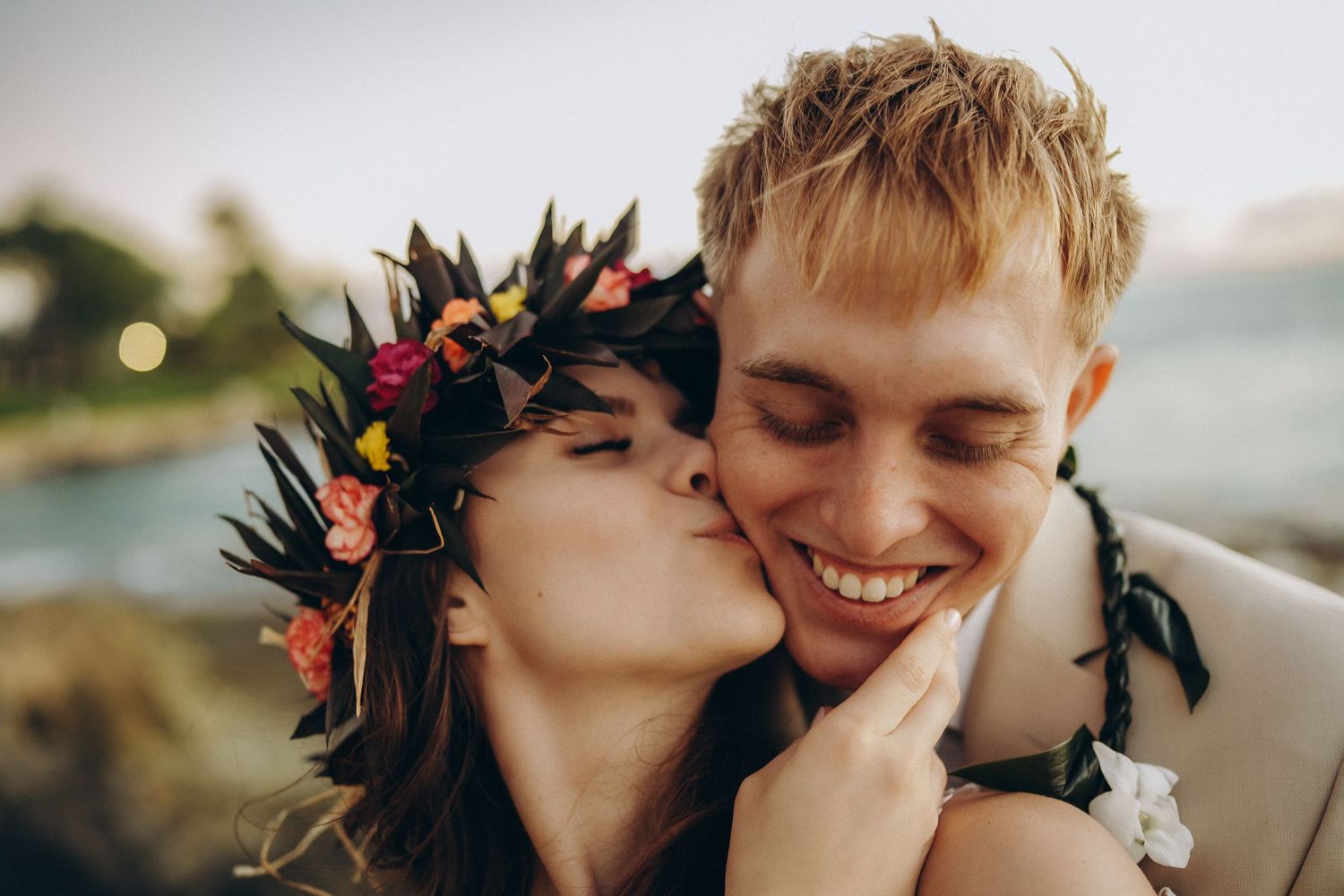 Romantic sunset wedding couple at Ko Olina, Oahu. Close-up portrait of a bride in a floral crown (Haku Lei) at Four Seasons Resort, captured