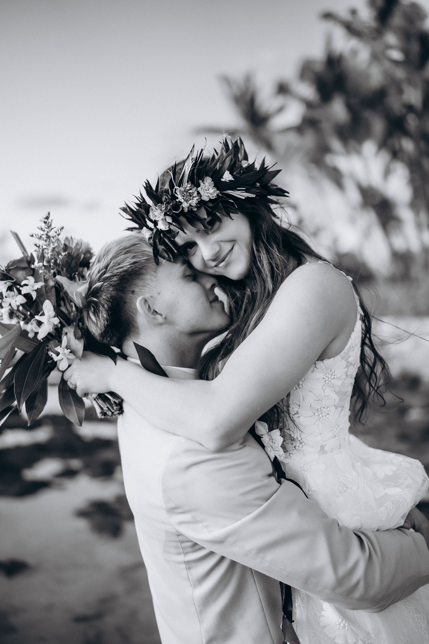 Emotional black and white wedding portrait at Four Seasons Resort Oahu. Bride in a traditional Haku Lei at Ko Olina lagoons.