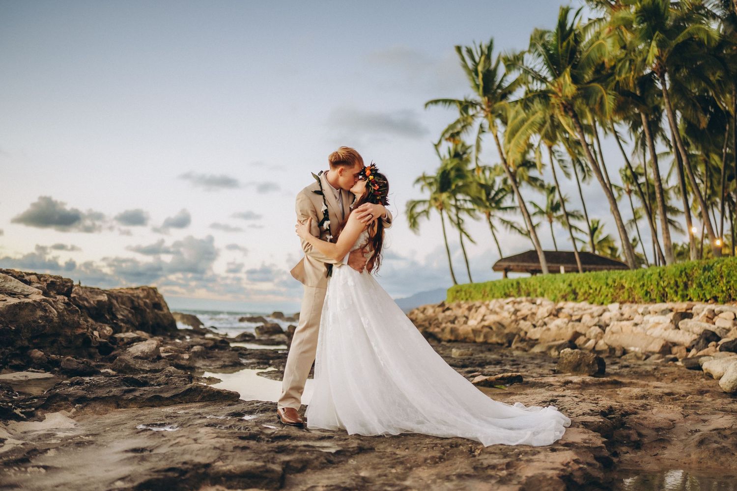 Sunset wedding couple at Four Seasons Resort Oahu at Ko Olina. Cinematic storytelling photography with Pacific Ocean and palm trees.