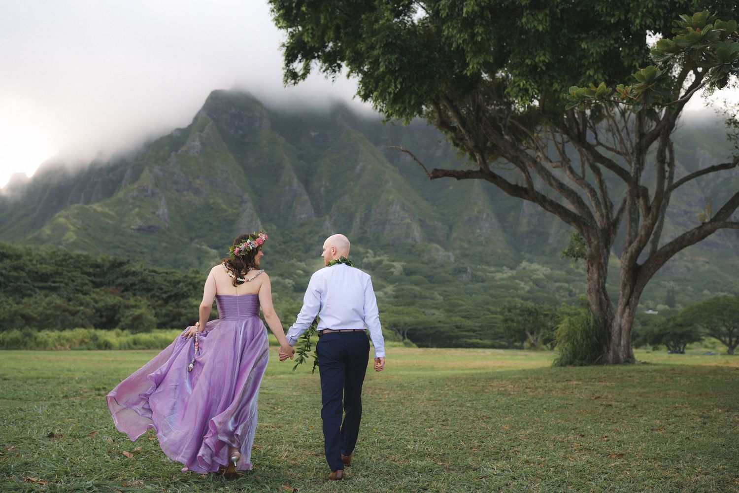 Couple embracing at the water's edge on Sandy Beach, Oahu couples photographer, Hawaii beach session
