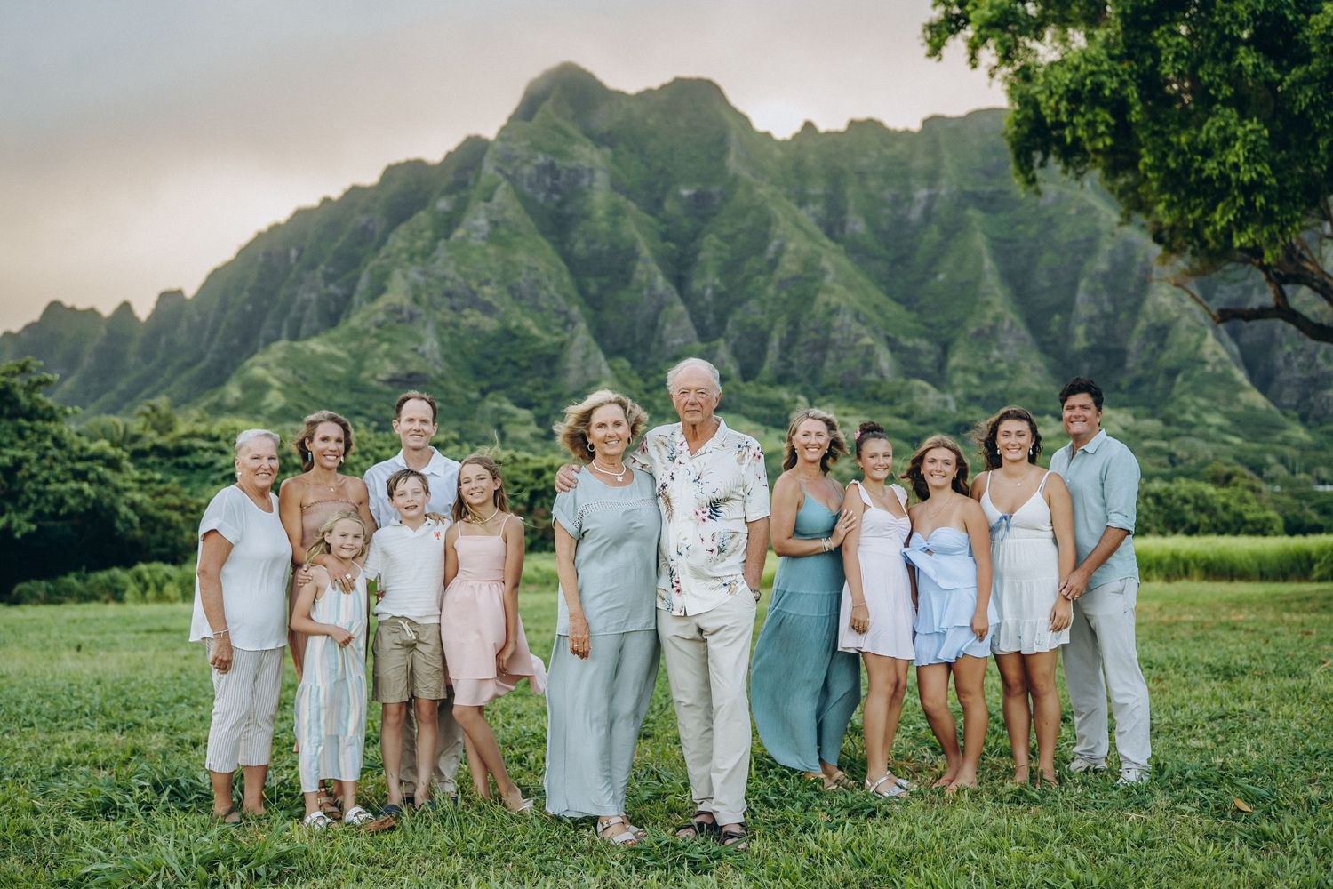 Three-generation family portrait with grandparents and grandchildren at Kualoa Ranch, Oahu family photography