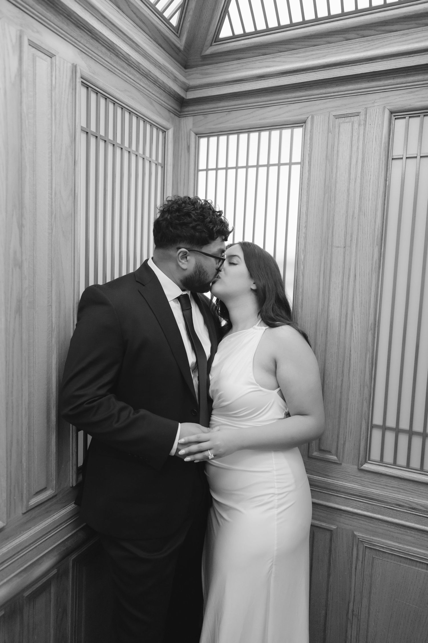 Romantic couple portrait at San Francisco City Hall dome interior
