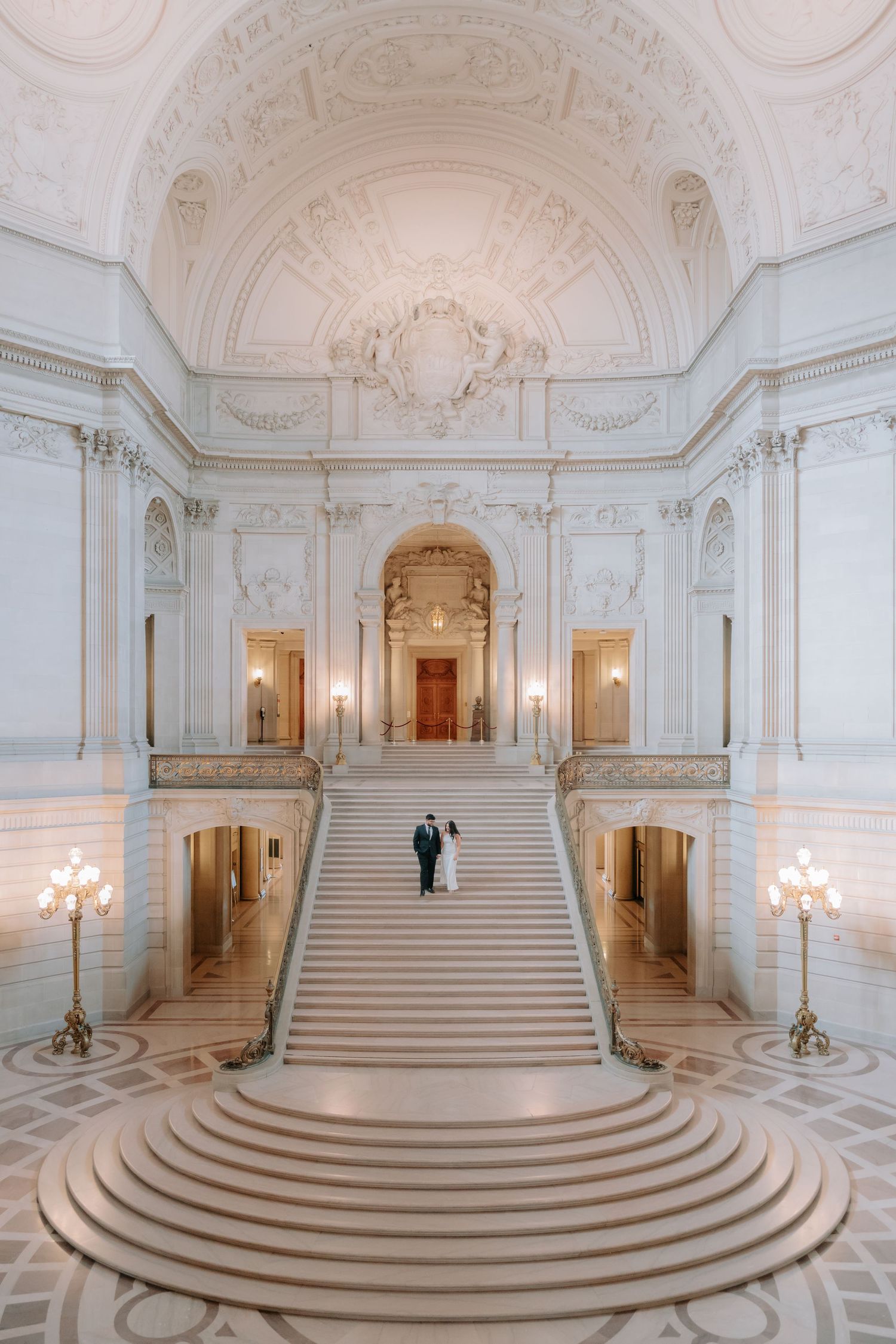 Romantic couple portrait at San Francisco City Hall dome interior