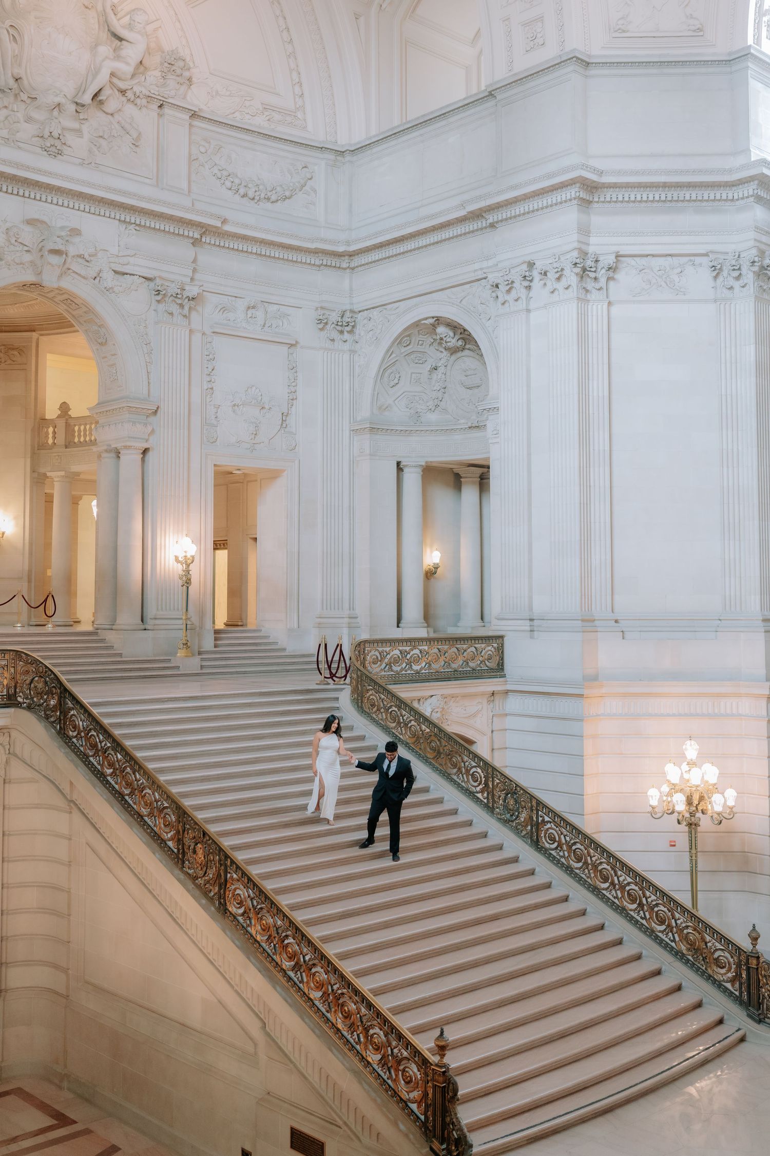 Romantic couple portrait at San Francisco City Hall dome interior
