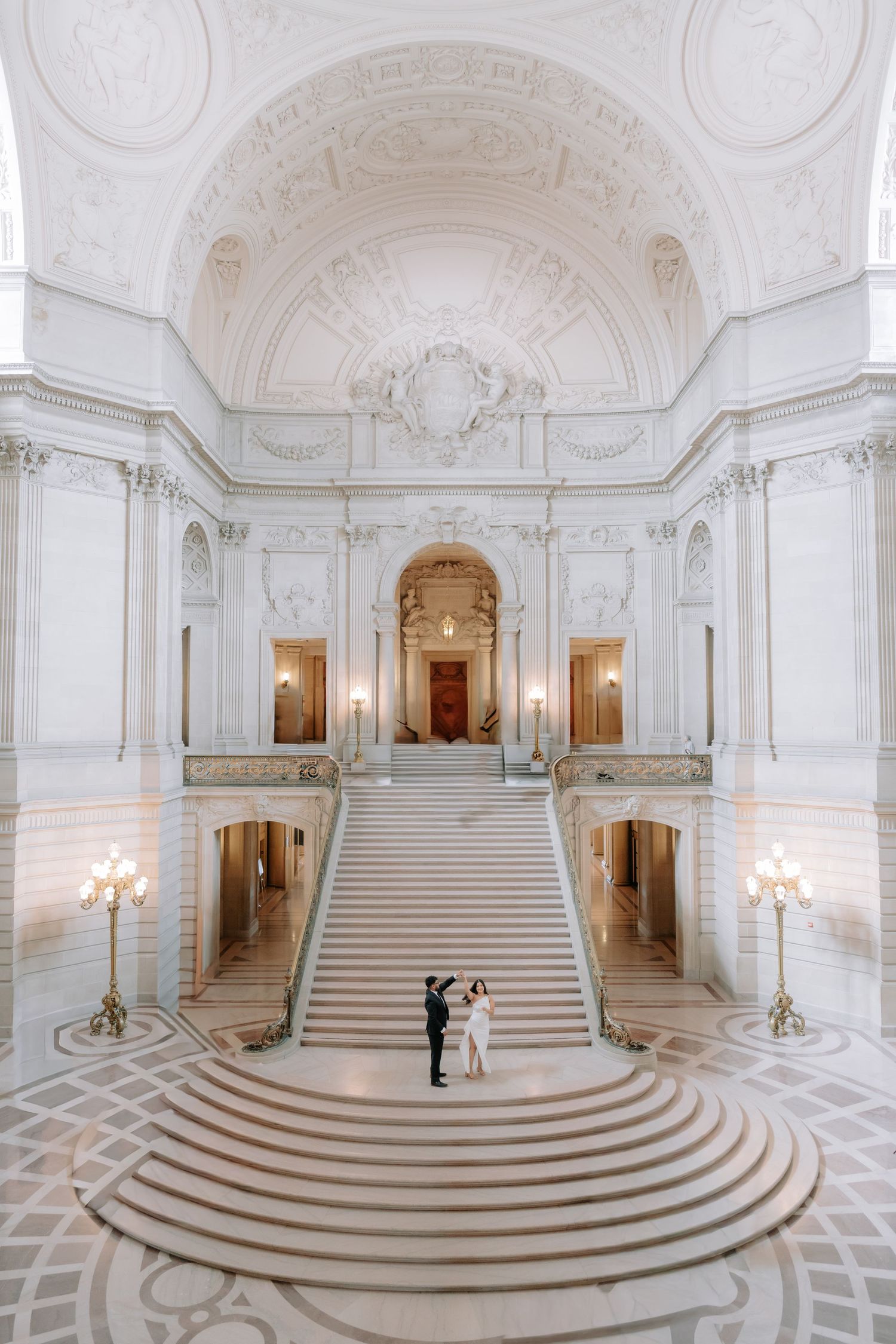 Romantic couple portrait at San Francisco City Hall dome interior