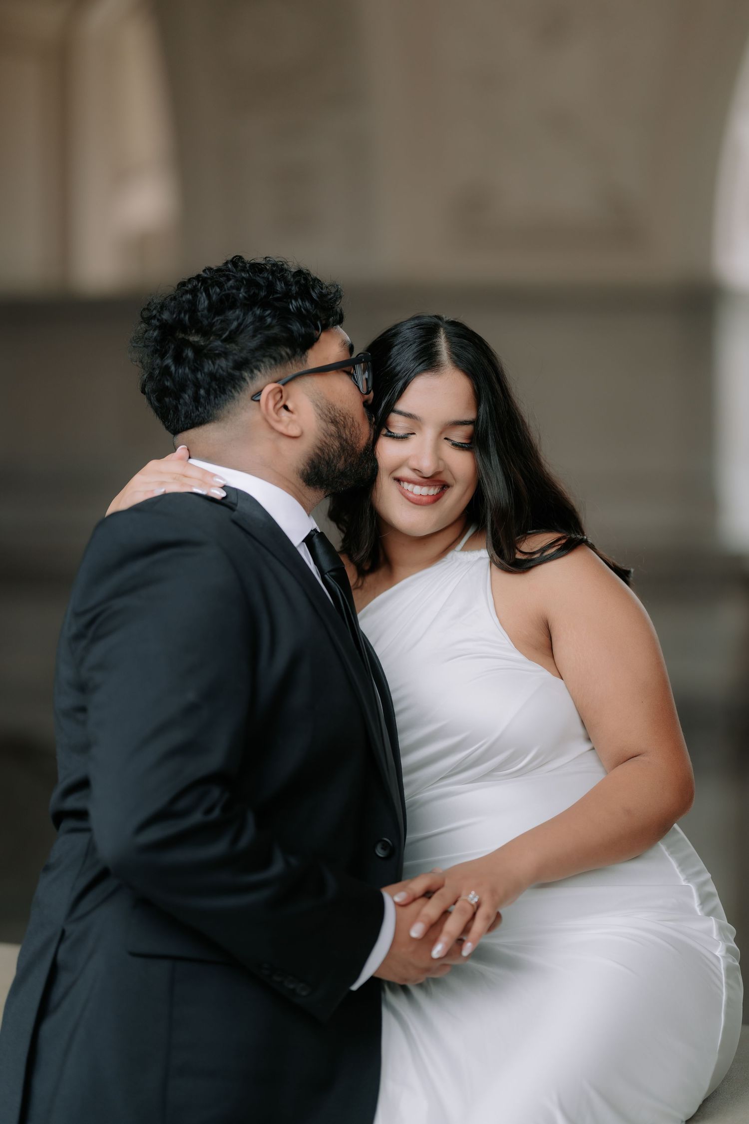 Romantic couple portrait at San Francisco City Hall dome interior