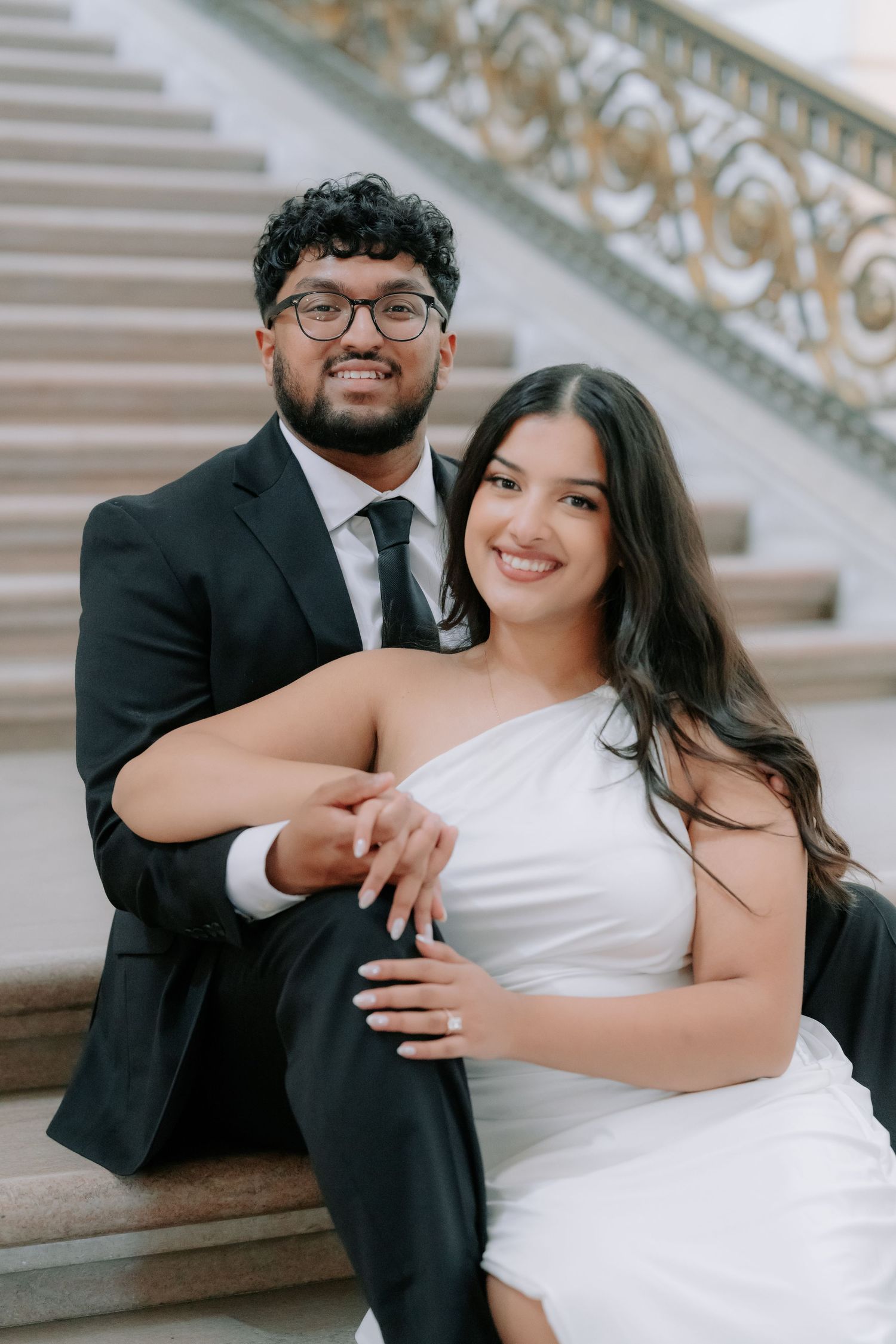 Romantic couple portrait at San Francisco City Hall dome interior