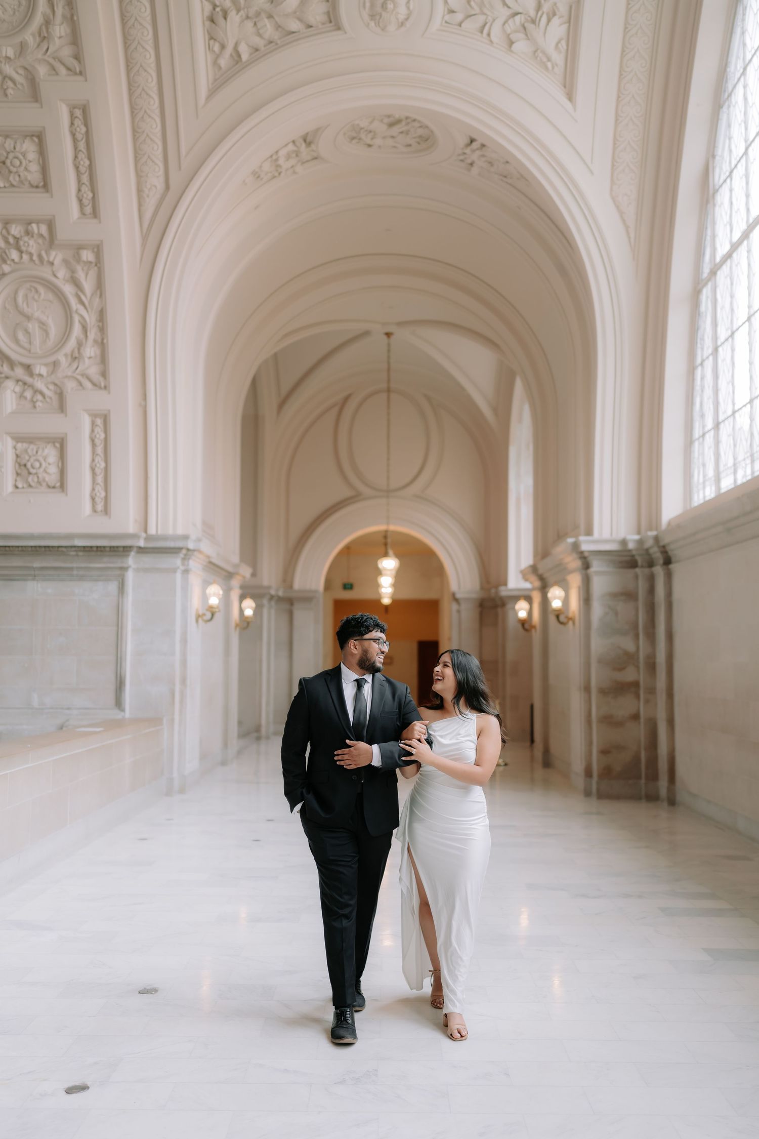 Romantic couple portrait at San Francisco City Hall dome interior