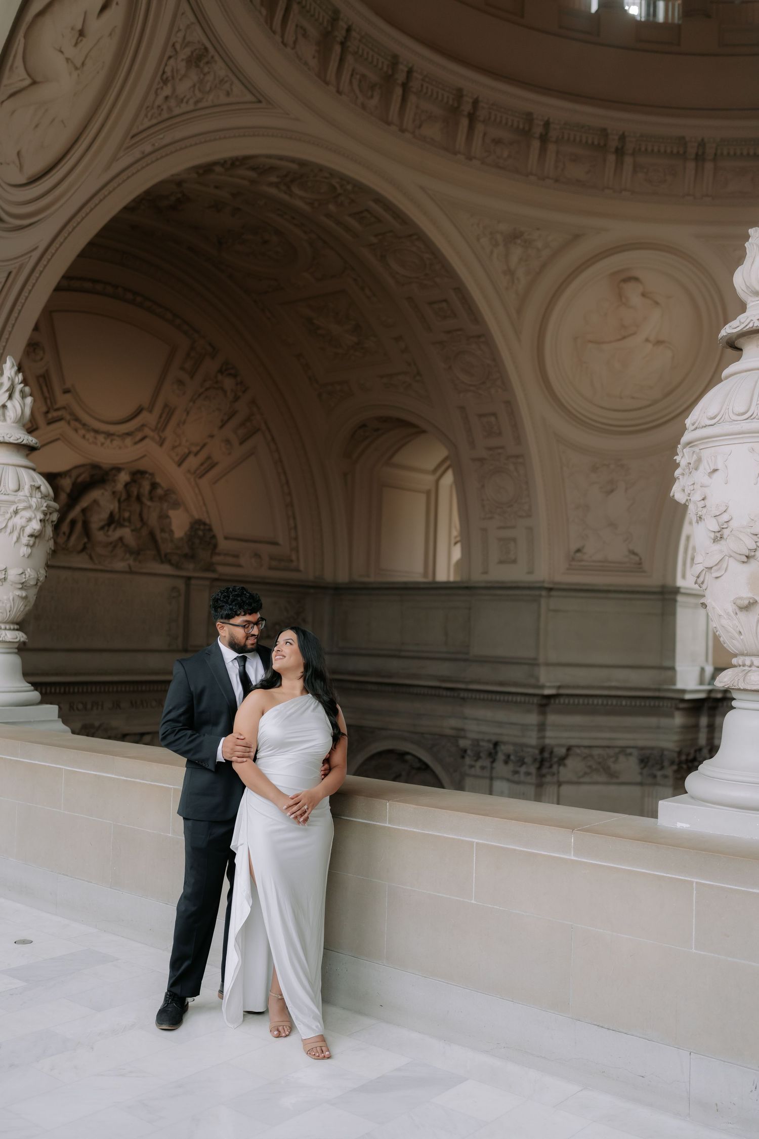 Romantic couple portrait at San Francisco City Hall dome interior
