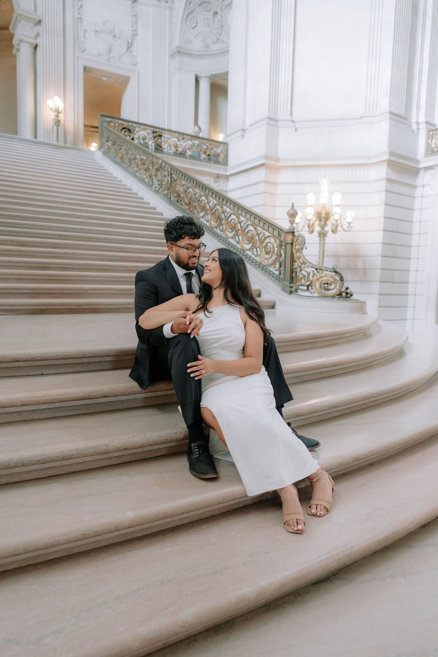 Romantic couple portrait at San Francisco City Hall dome interior