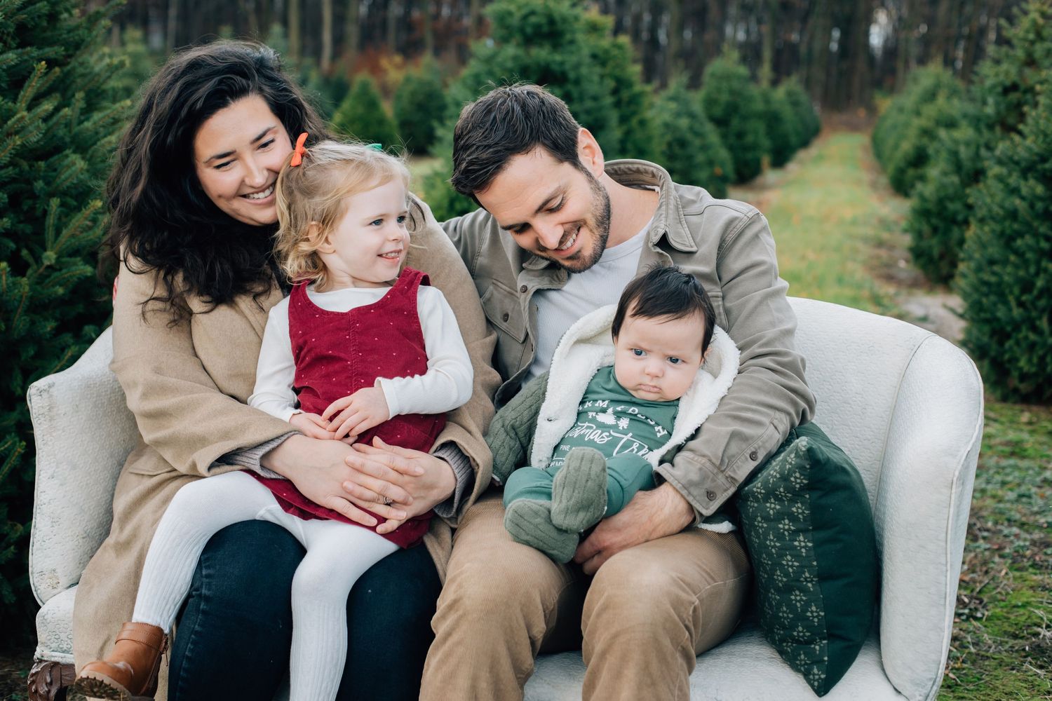 Festive holiday photo with family in at Christmas Tree farm