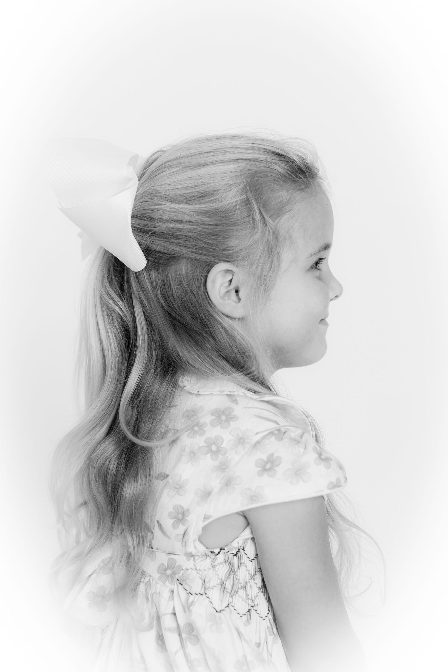 Side profile portrait series in black and white showing flowing hair movement.