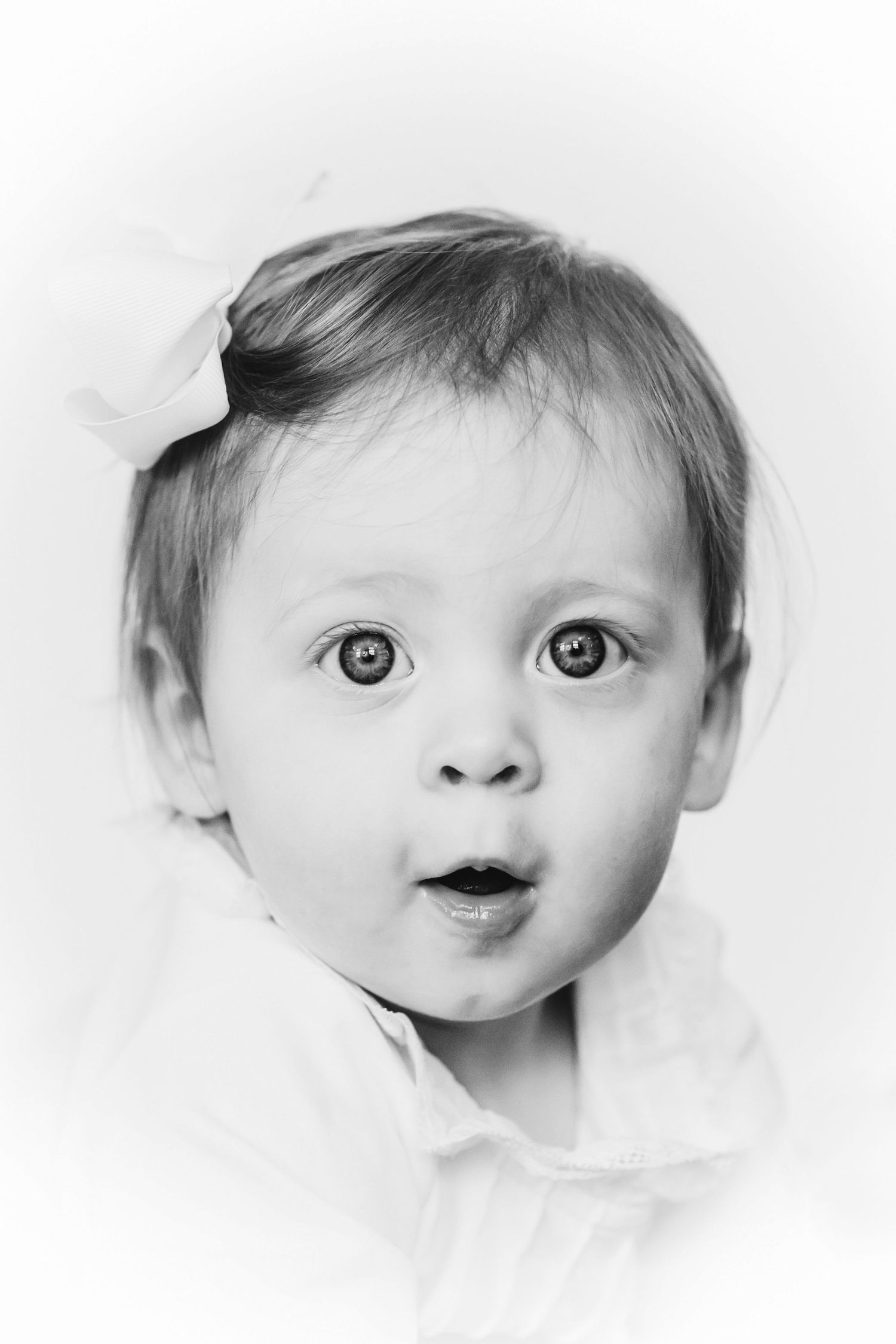 Artistic black and white close-up portraits showing various expressions.