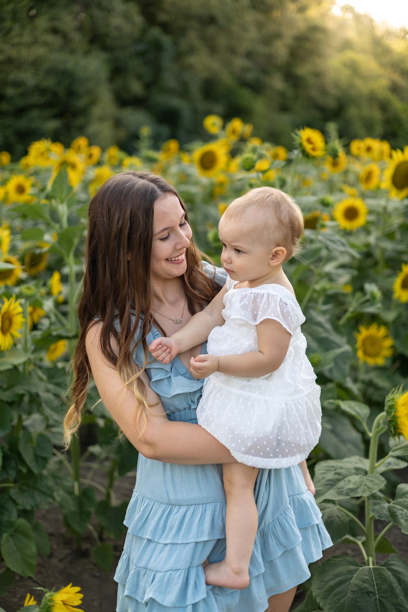 Mom and mini daughter session photography photographer Rosedale Mississippi sunflower field floral sunset