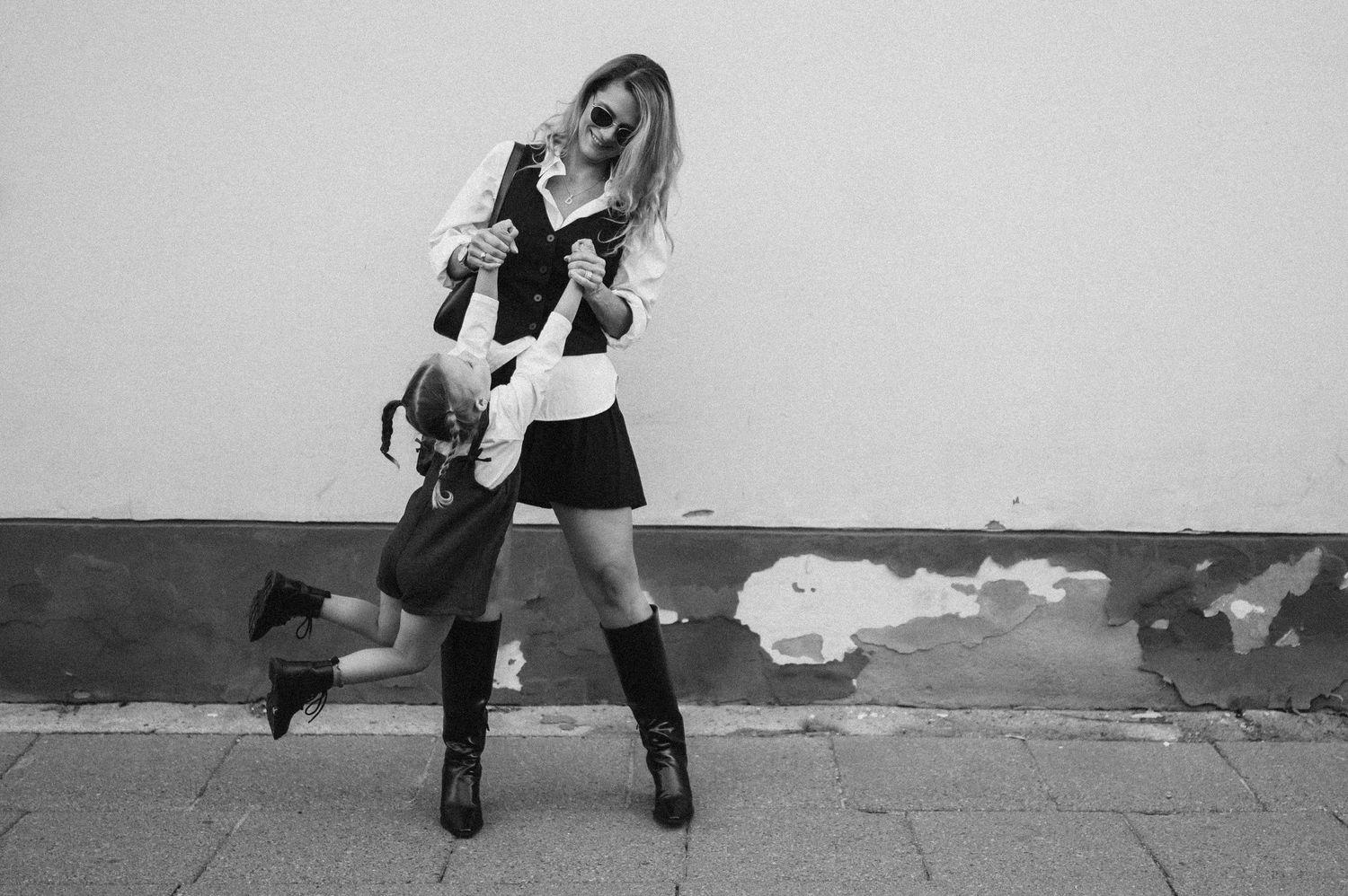 Series of dynamic black and white lifestyle photos showing playful moments.