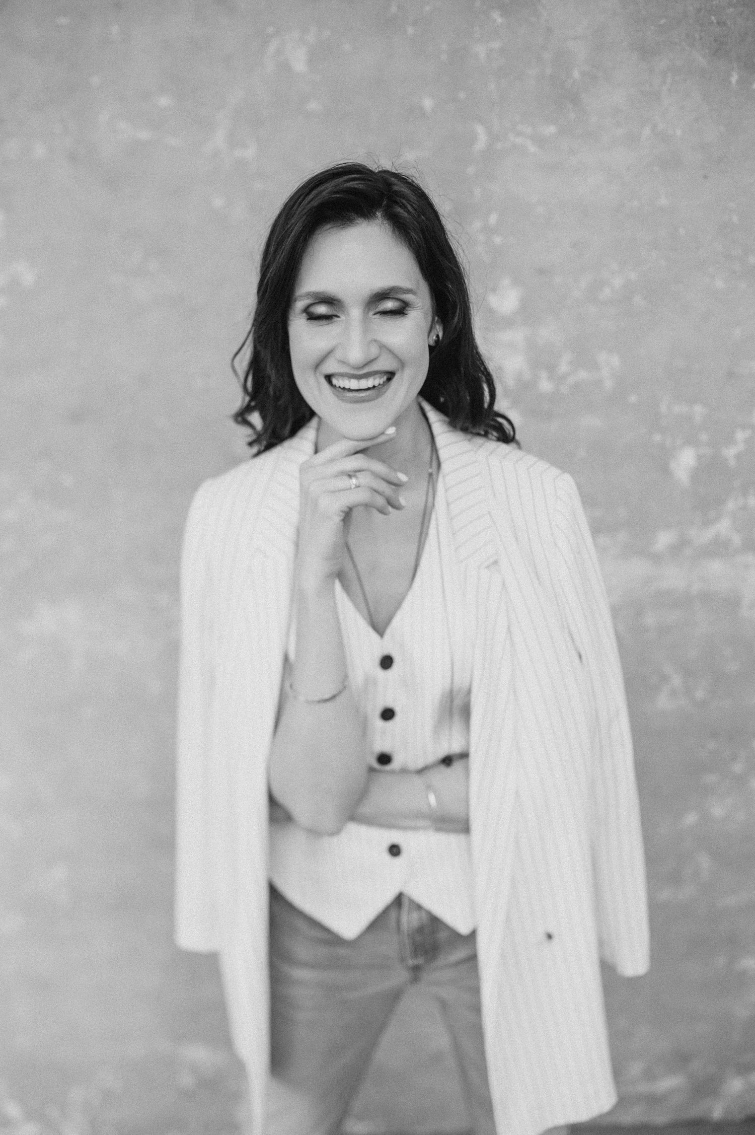 Black and white fashion series featuring pinstripe blazer and casual styling.