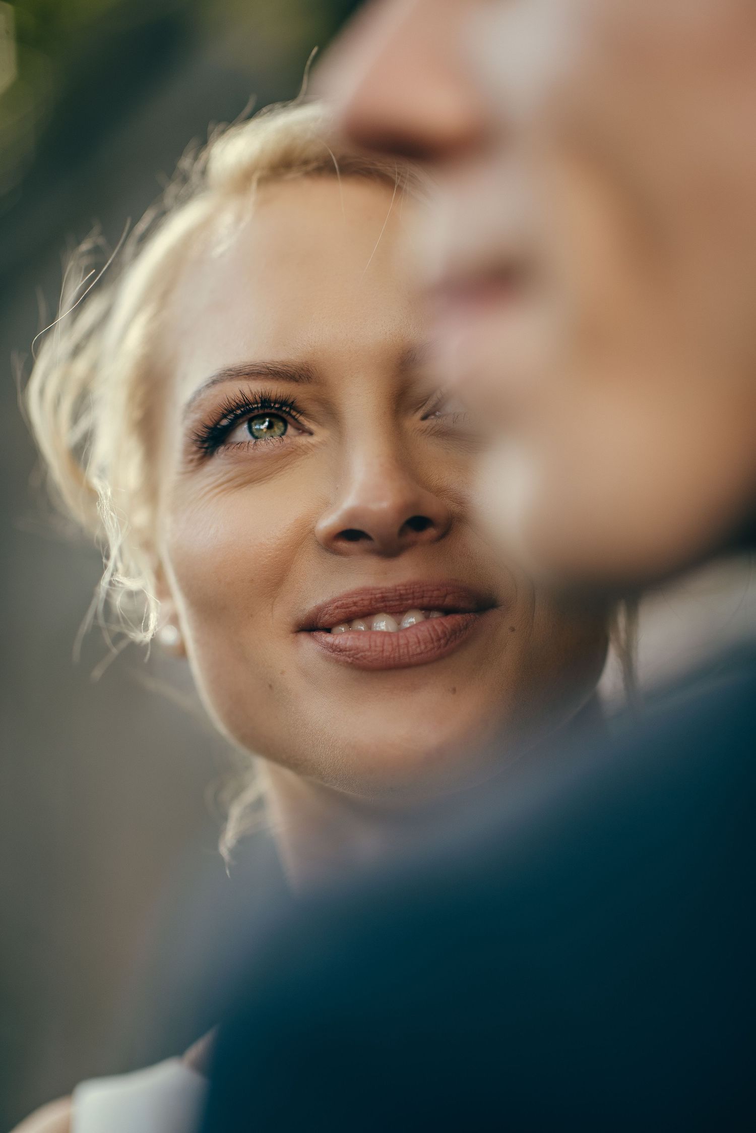 Artistic close-up portrait with soft focus and dreamy lighting effects.