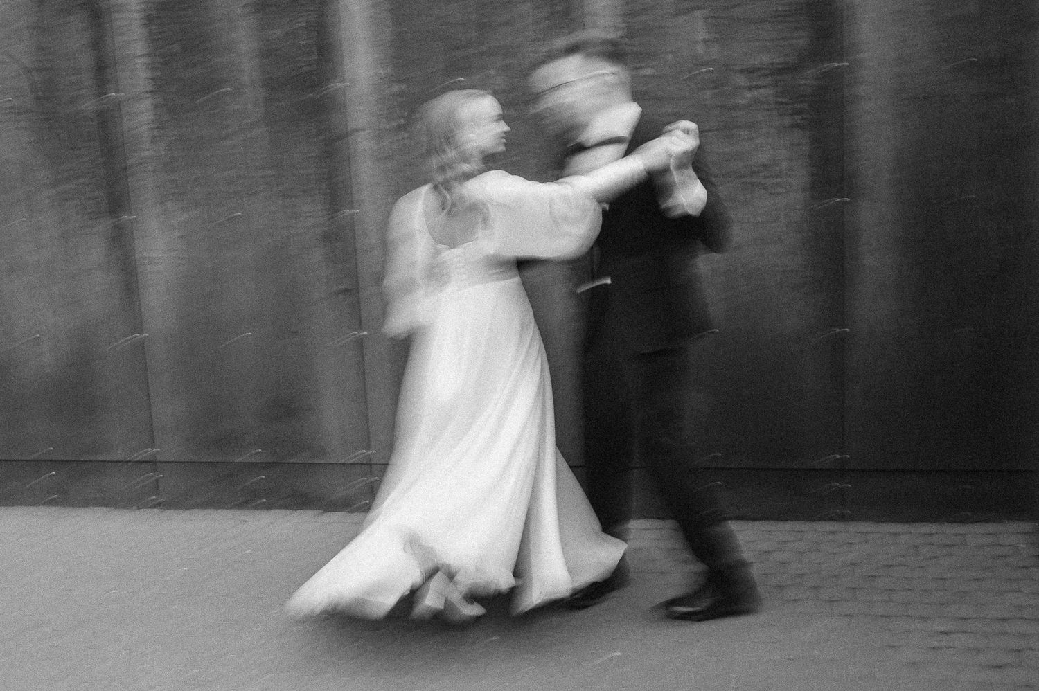 Black and white sequence showing couples dancing in formal attire at an elegant event.