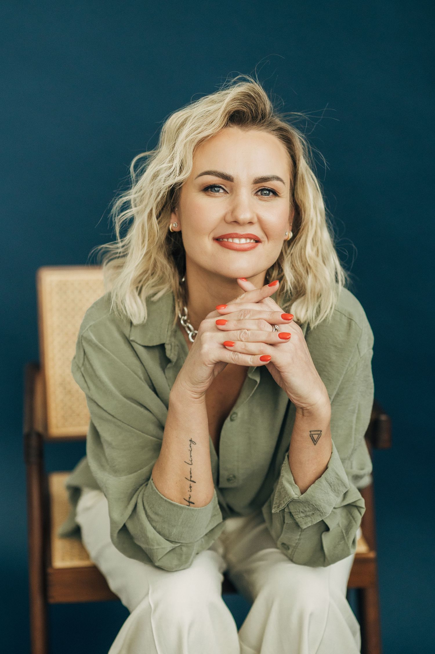 Casual portrait series showing joyful expressions while wearing olive green shirt against dark background.