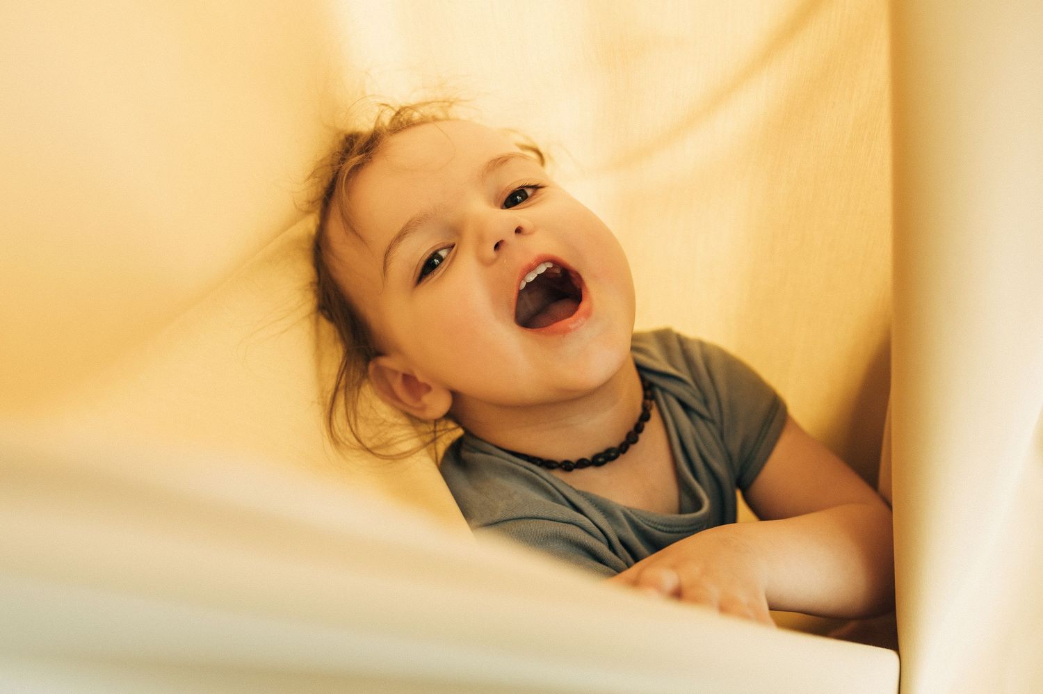 Sequential photos showing joyful expressions and laughter in warm lighting.