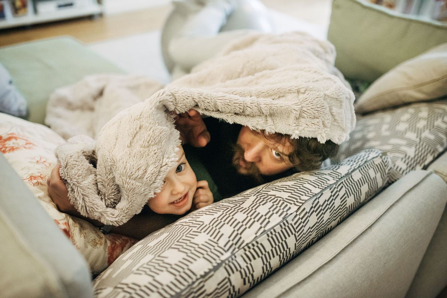 Cozy moments under soft blankets during quiet time at home.
