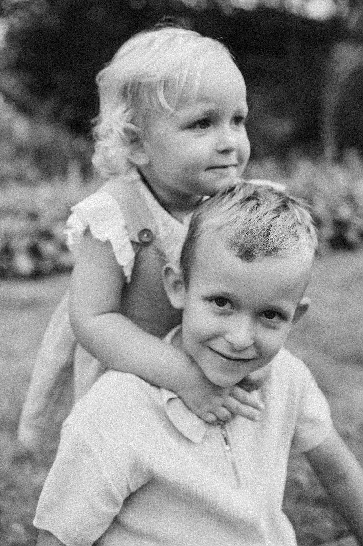 Black and white close-up portrait sequence showing natural expressions and emotions.