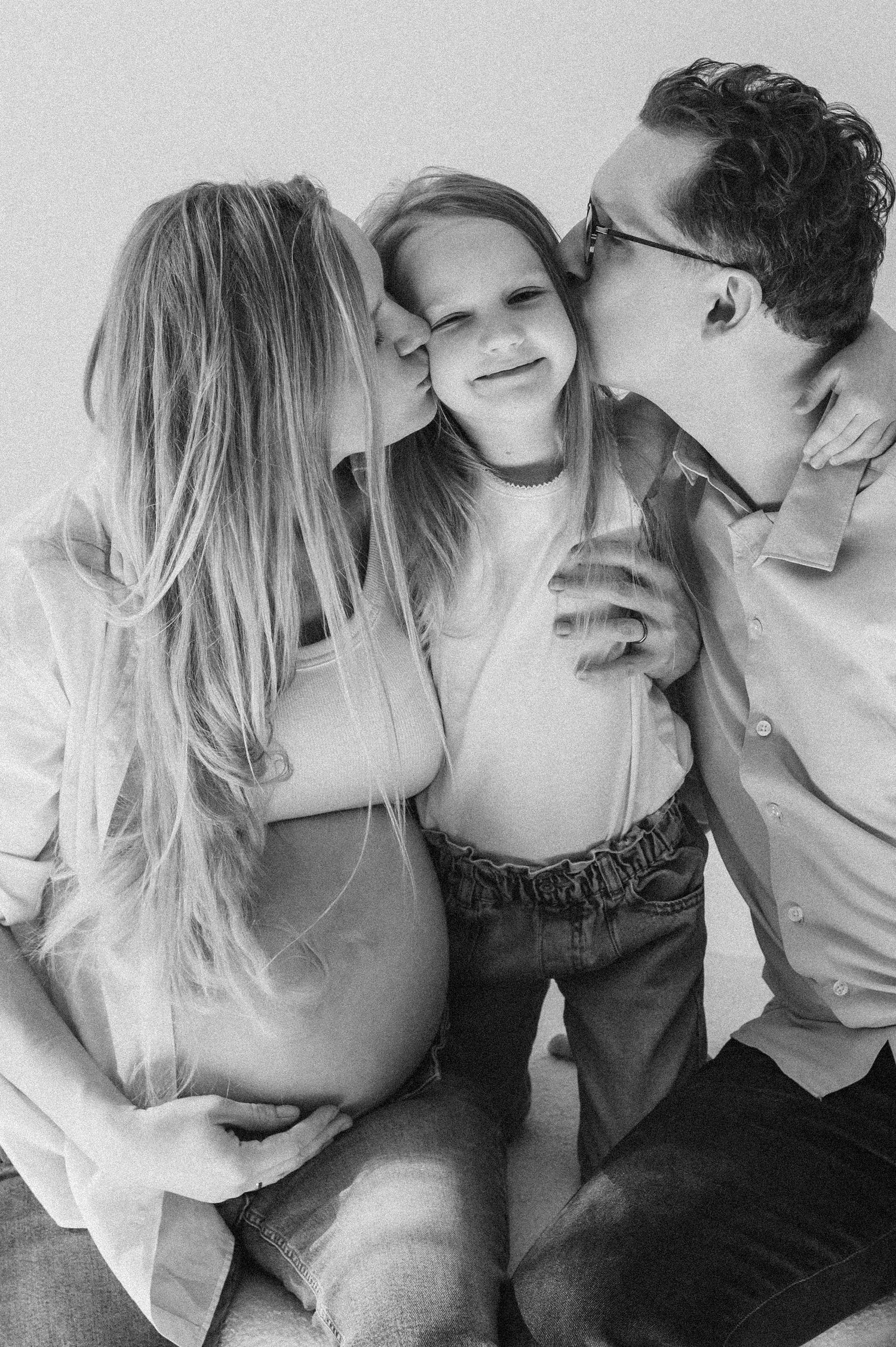 Intimate black and white portrait series featuring tender moments between a couple.