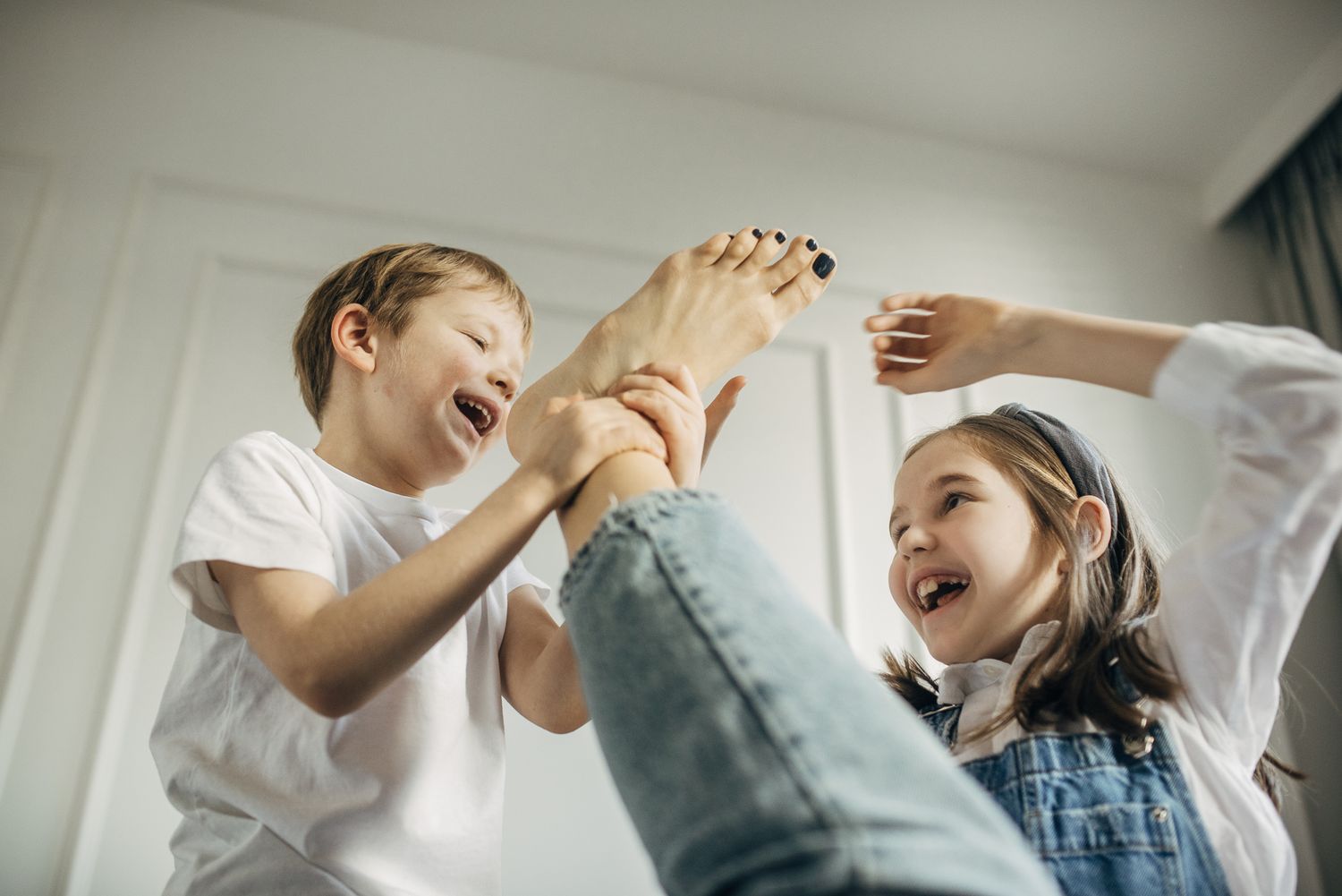 Series of candid lifestyle photos showing playful interactions in a bright indoor setting.
